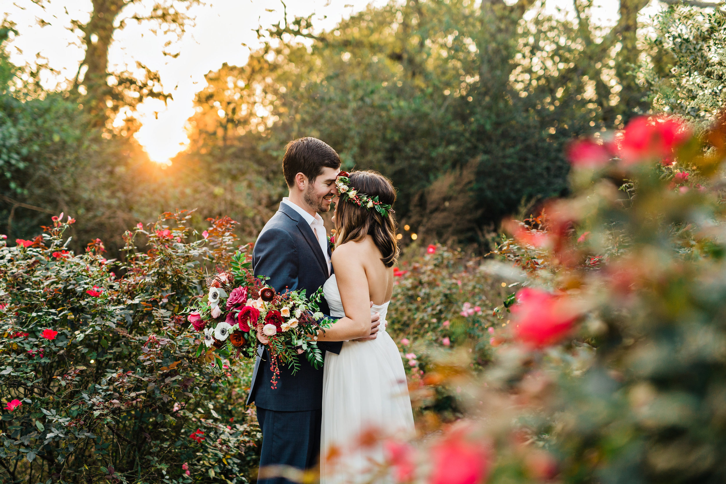 Lush, untamed wedding flowers using deep red and burgundy garden roses and ranunculus // Nashville Wedding Florist