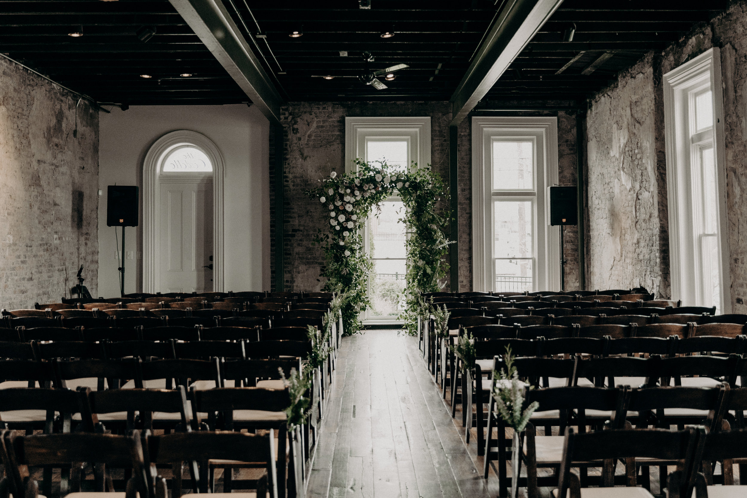 Wedding ceremony in the Victorian room at the Cordelle--lush, untamed floral arch  // Nashville Wedding Florist