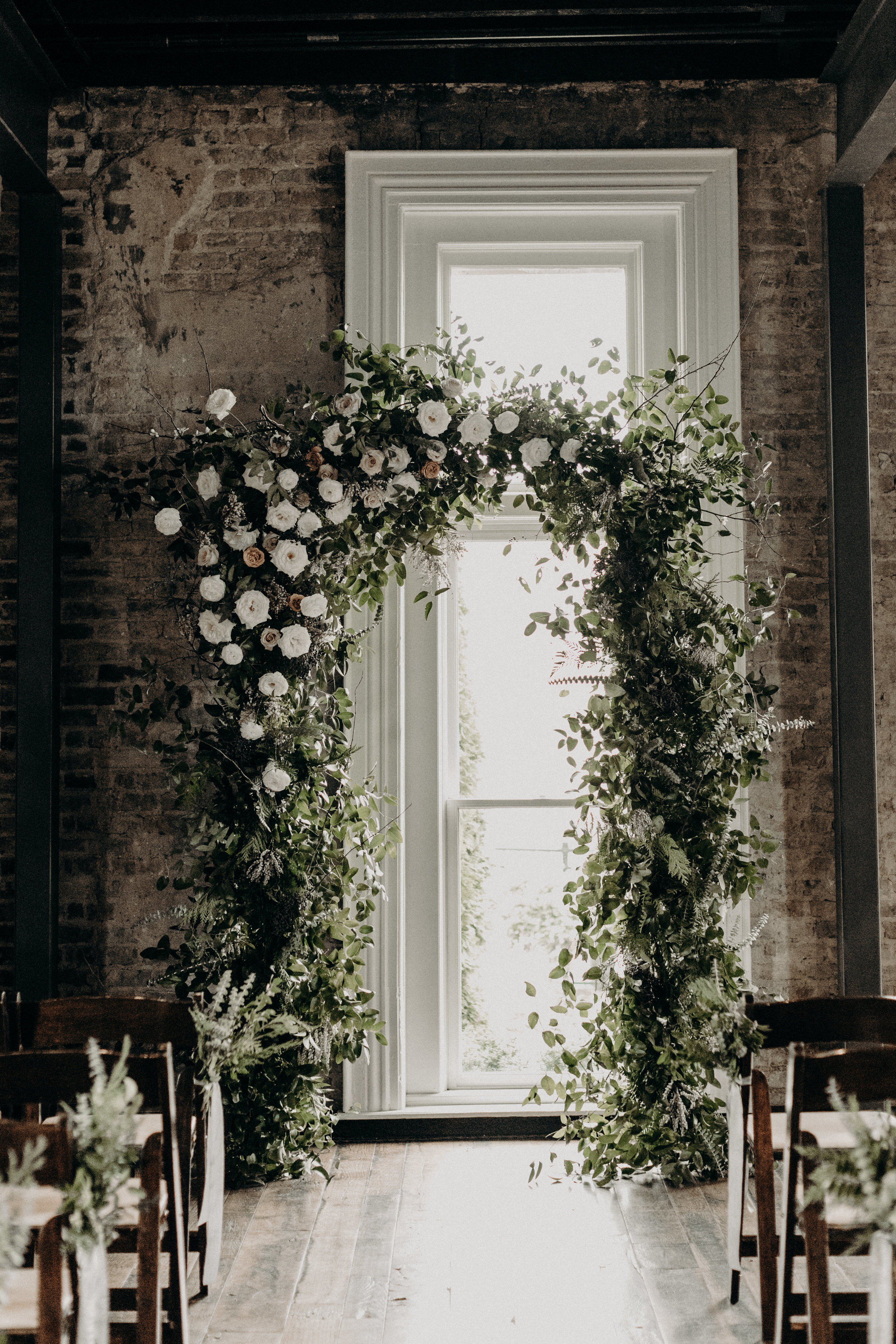 Lush, natural arch with organic greenery and neutral/ivory flowers  // Nashville Wedding Florist