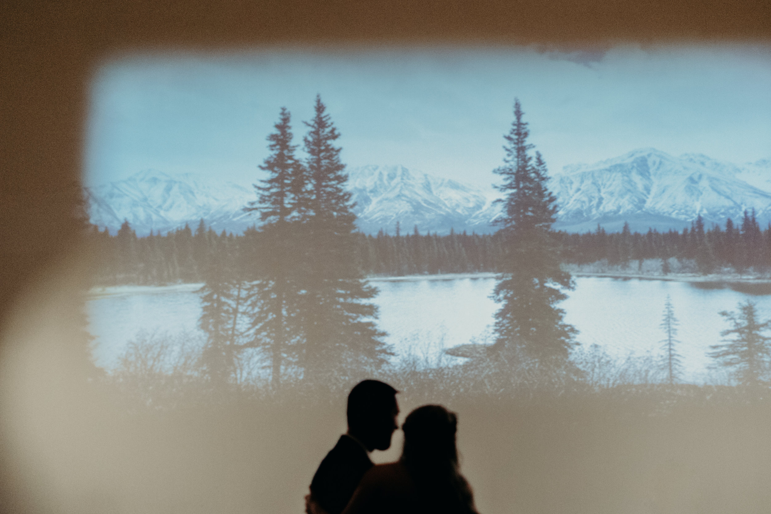 Alaska Mountains projected on a large white wall over the dancefloor  // Nashville Wedding Florist