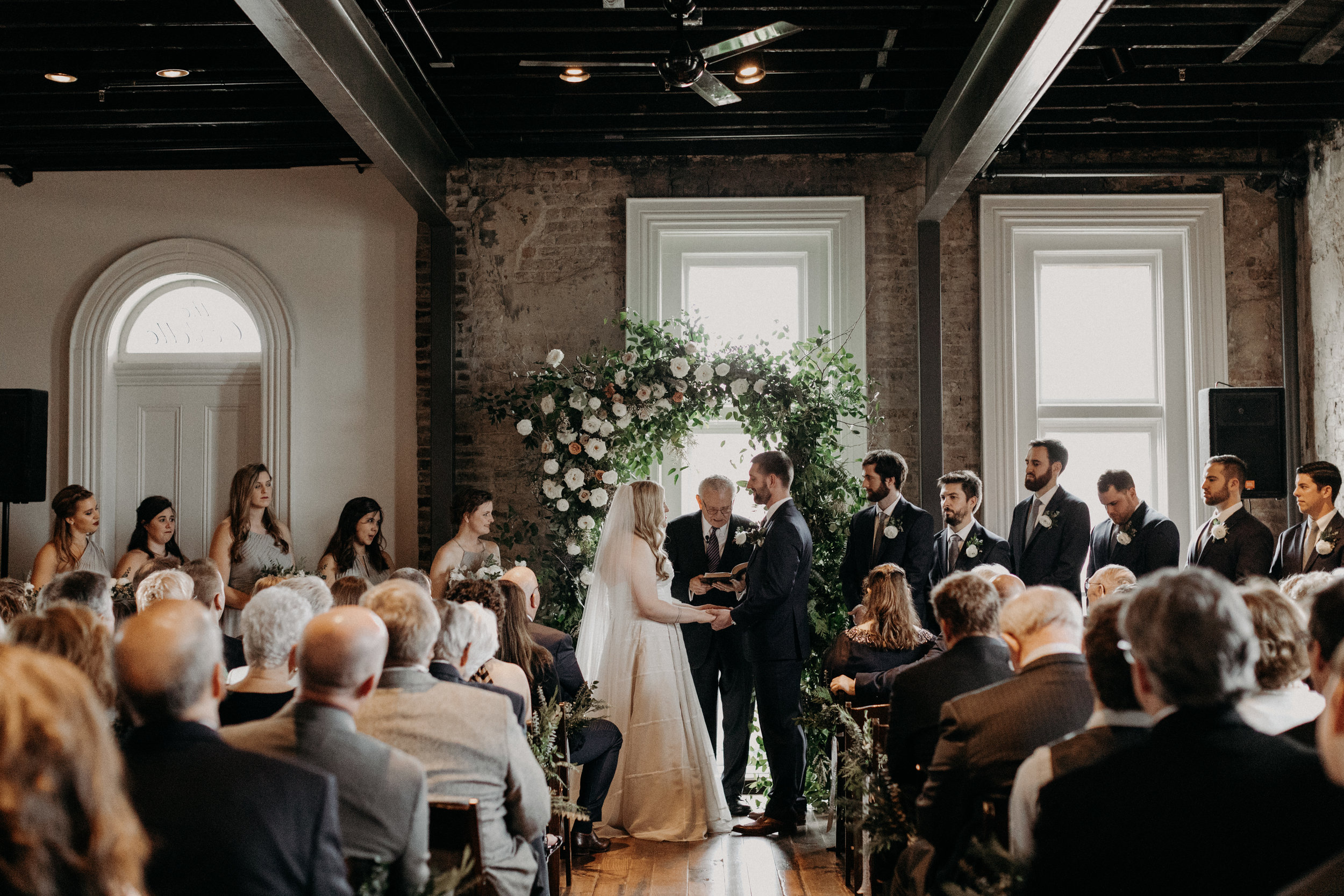 Winter wedding ceremony with a lush floral arch  // Nashville Wedding Floral Design