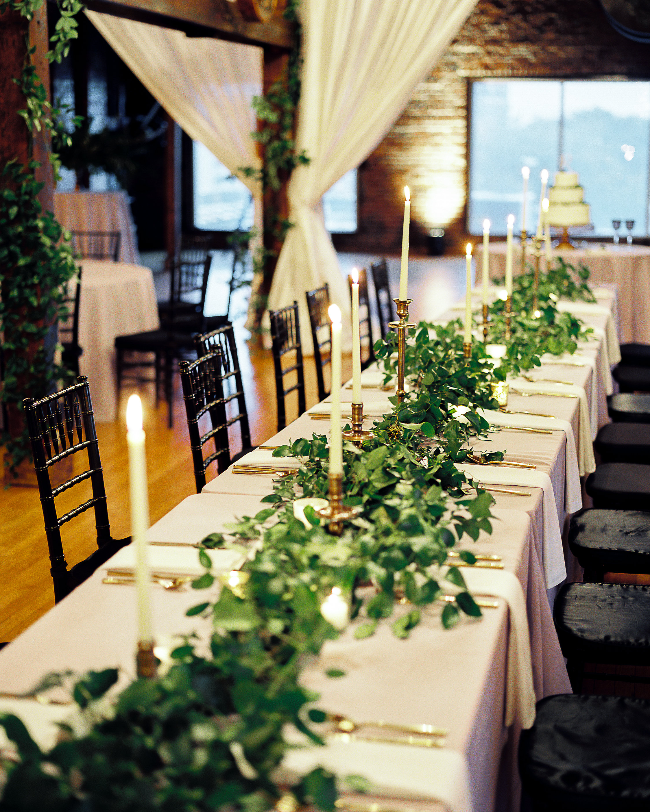Natural greenery runner for the head table with brass candlesticks // Nashville Wedding Floral Design at Cannery One