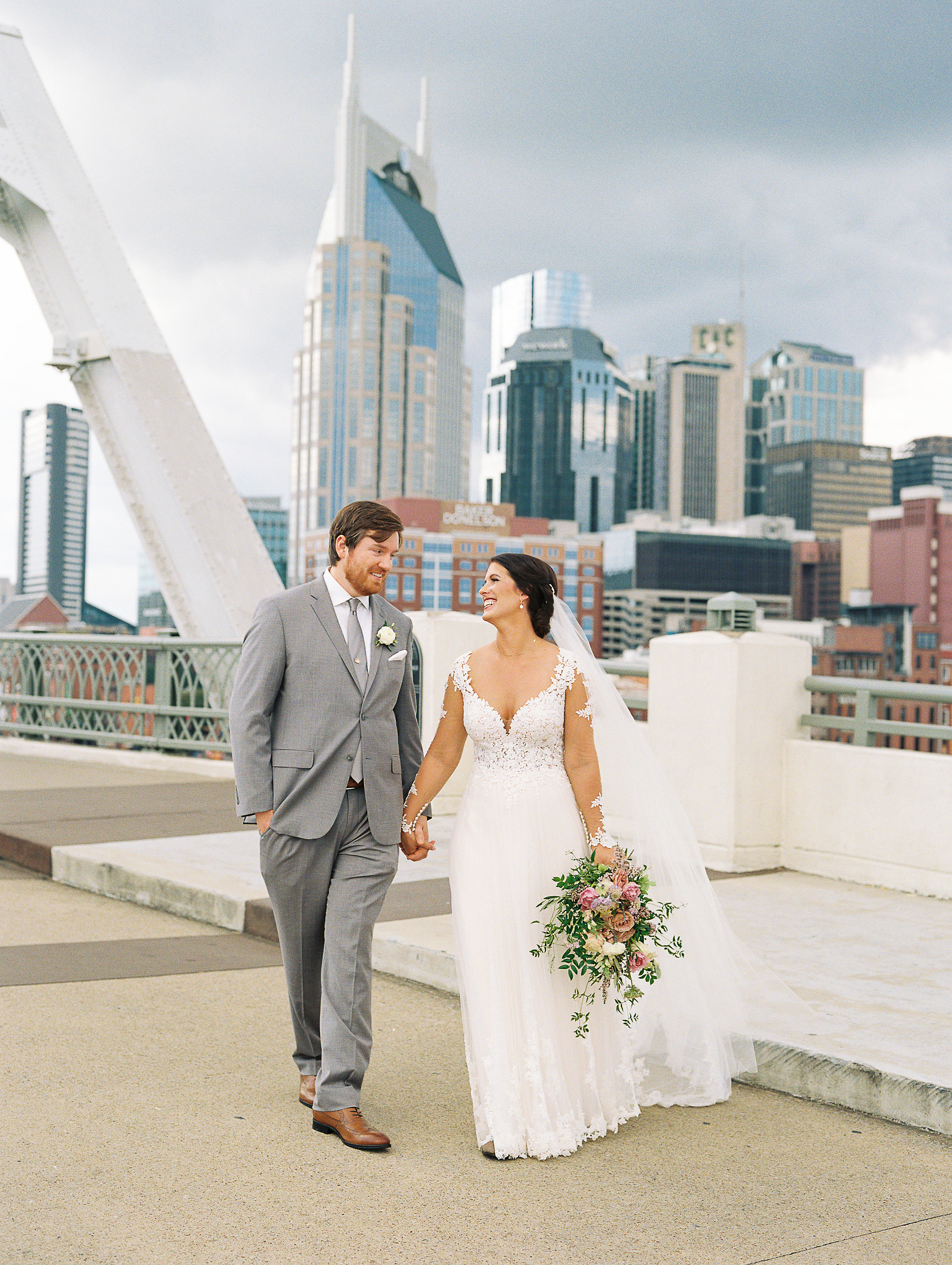 Lush greenery and lavender flowers // Newlywed portraits on the Shelby Bridge // Nashville Wedding Floral Design