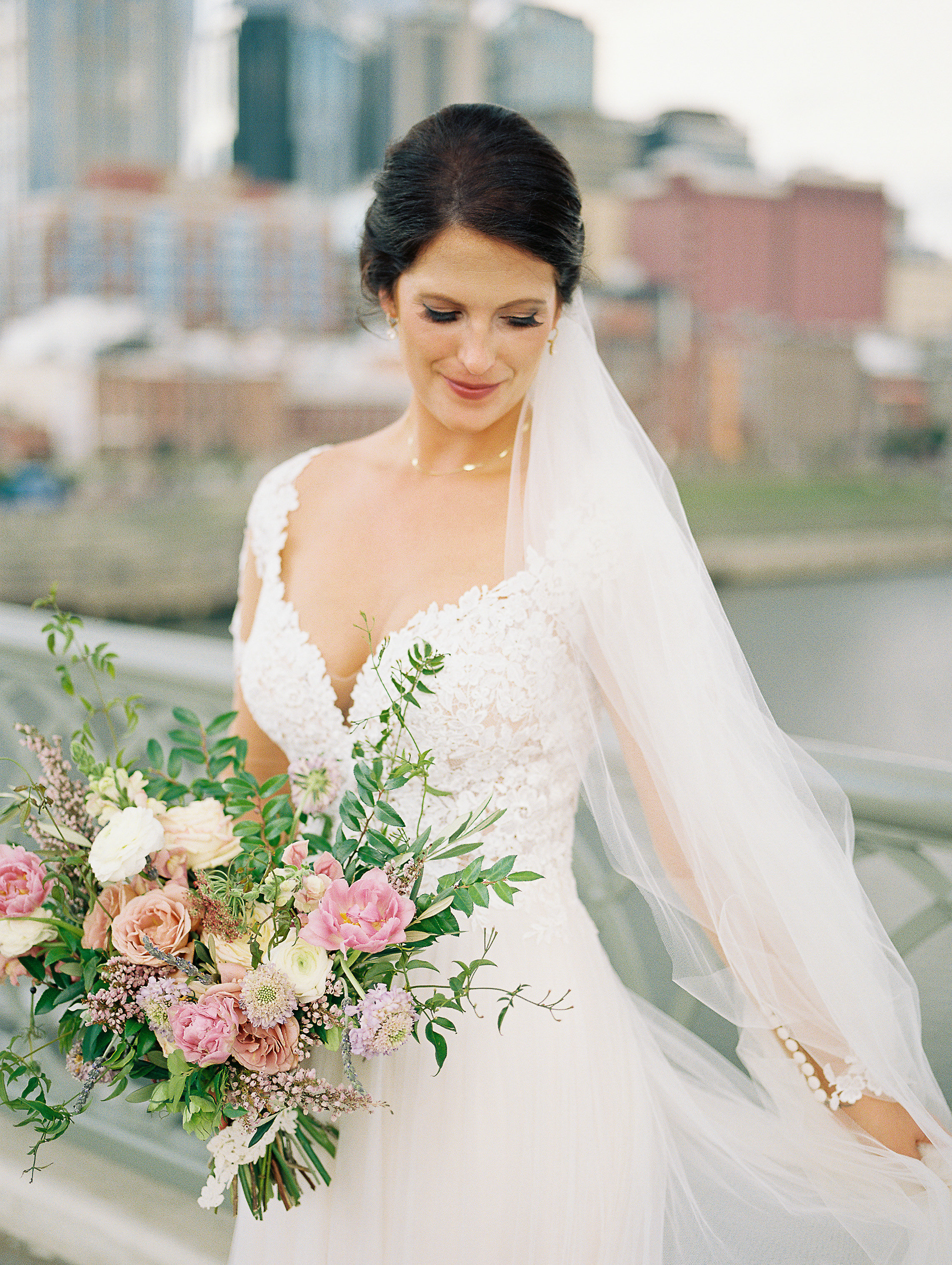 Lush bridal bouquet with garden roses, ranunculus, heather, and jasmine // Nashville Wedding Florist