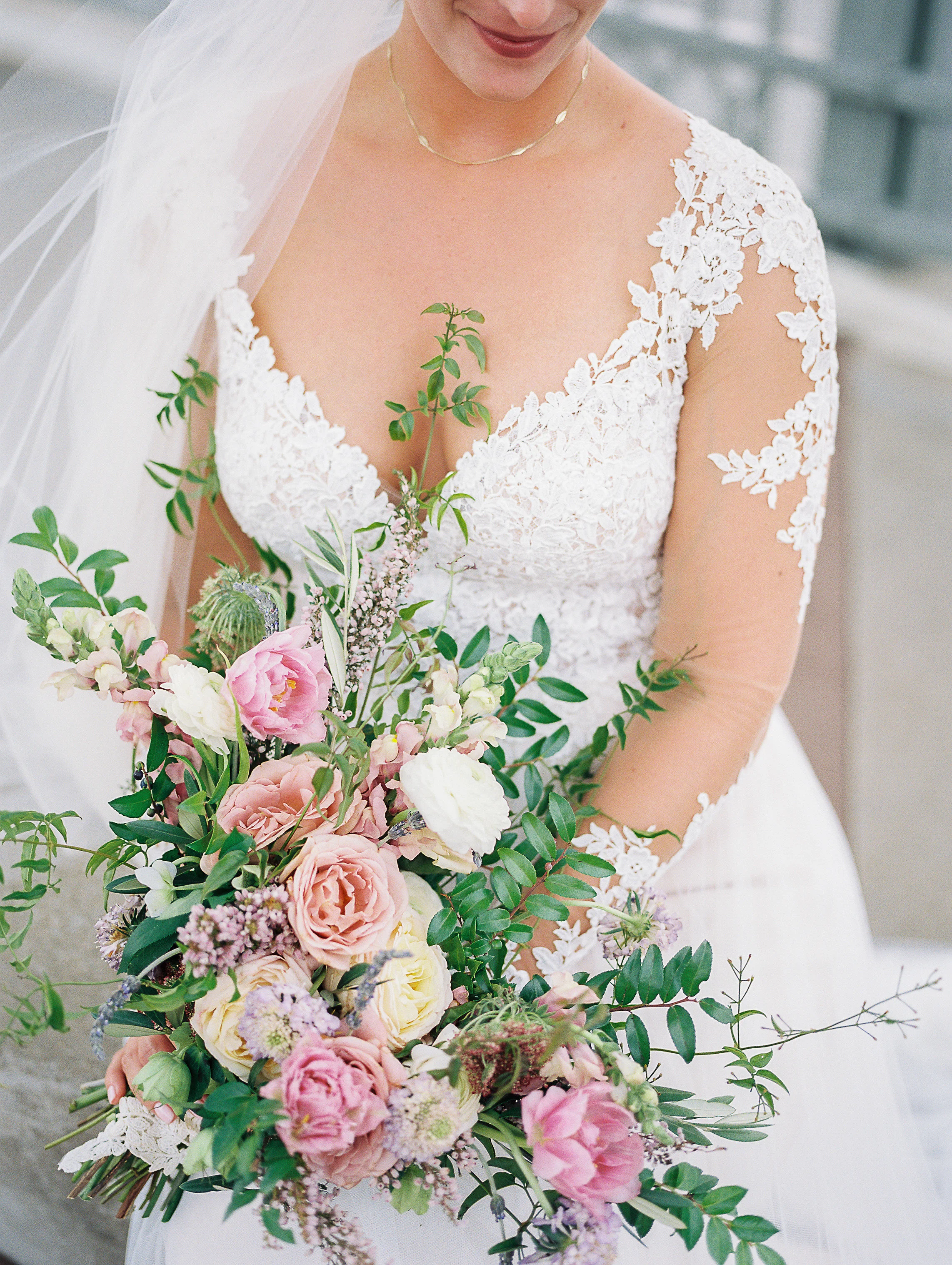Natural, lush bridal bouquet with garden roses, ranunculus, and greenery // Nashville Wedding Floral Design