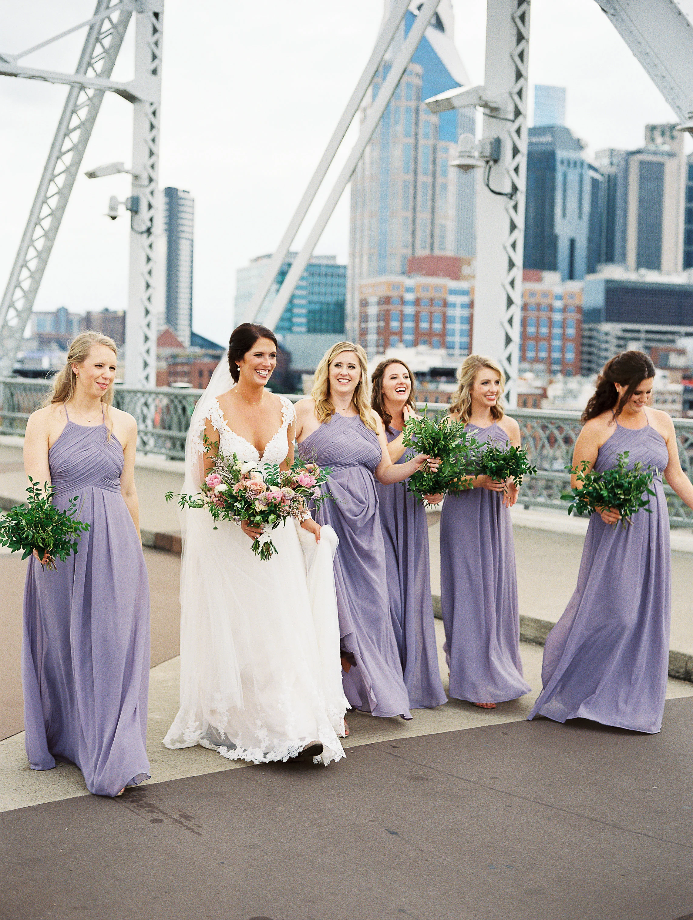 Natural, lush bridal bouquet with garden roses, ranunculus, and greenery // All greenery bridesmaid bouquets // Nashville Wedding Floral Design
