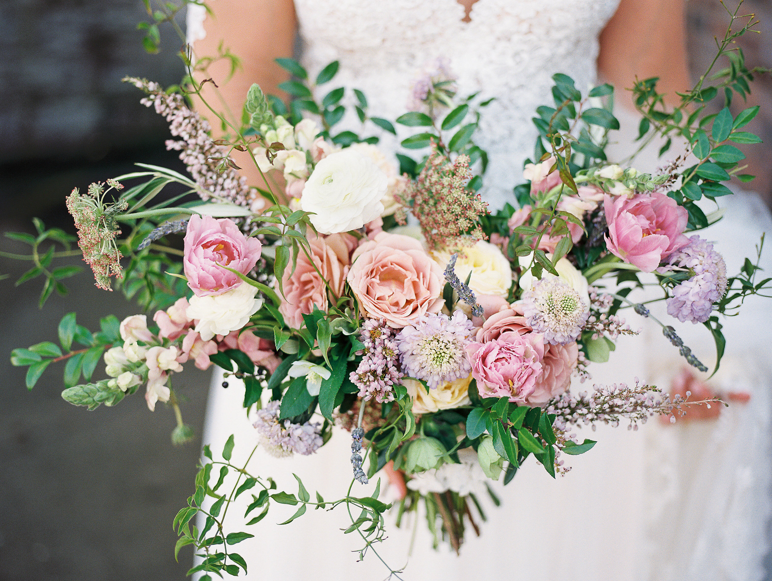 Natural, lush bridal bouquet with garden roses, ranunculus, and greenery // Nashville Wedding Floral Design
