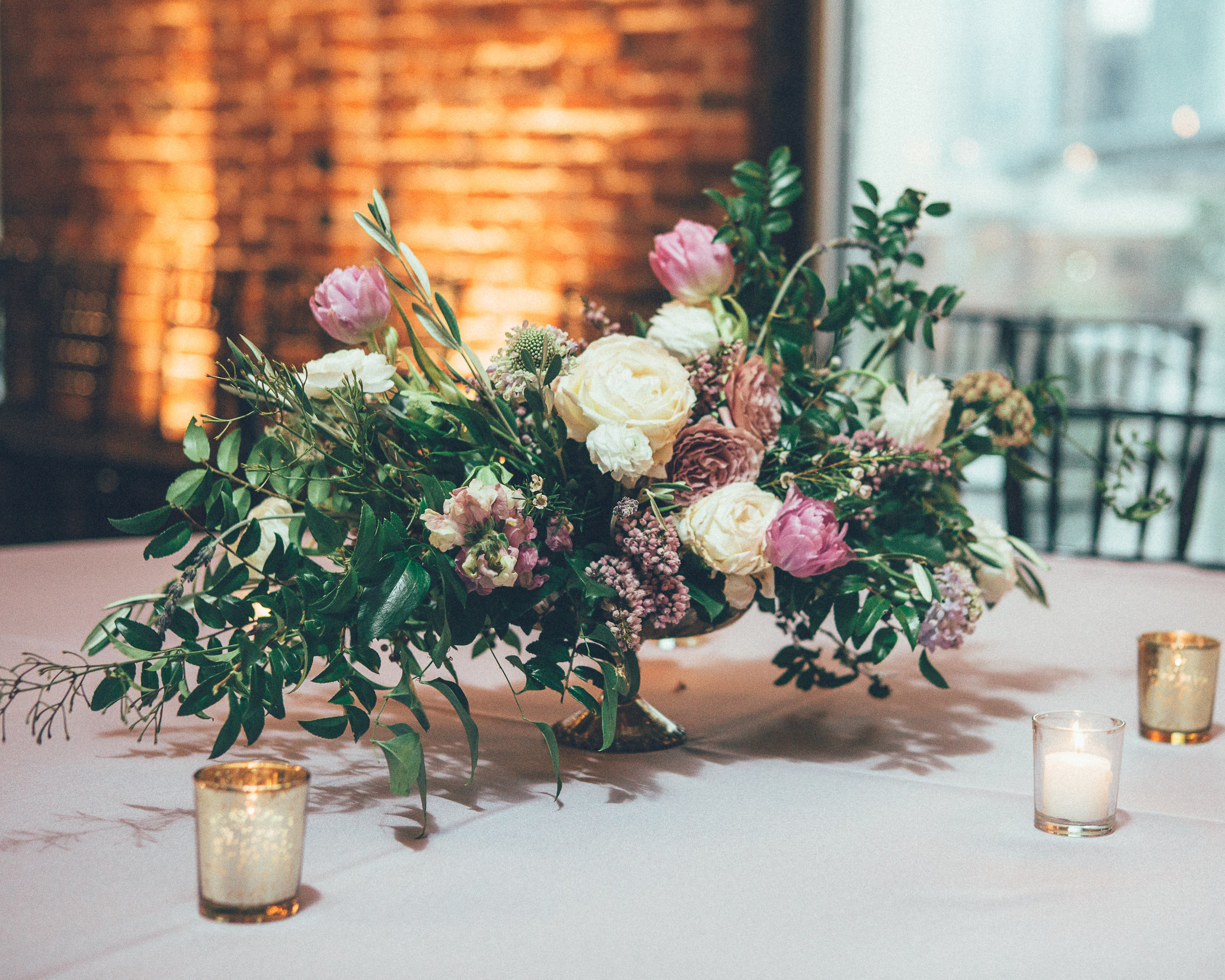 Low centerpiece with lavender flowers and organic greenery // Nashville Wedding Floral Design