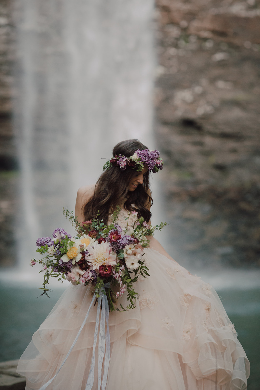 Lush bridal bouquet with lilac, peonies, cafe au lait dahlias, and butterfly ranunculus // Nashville Waterfall Elopement Floral Design