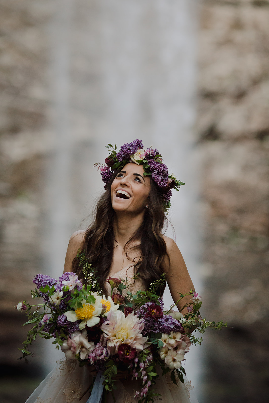 Lush bridal bouquet with lilac, peonies, cafe au lait dahlias, and butterfly ranunculus // Nashville Waterfall Elopement Floral Design