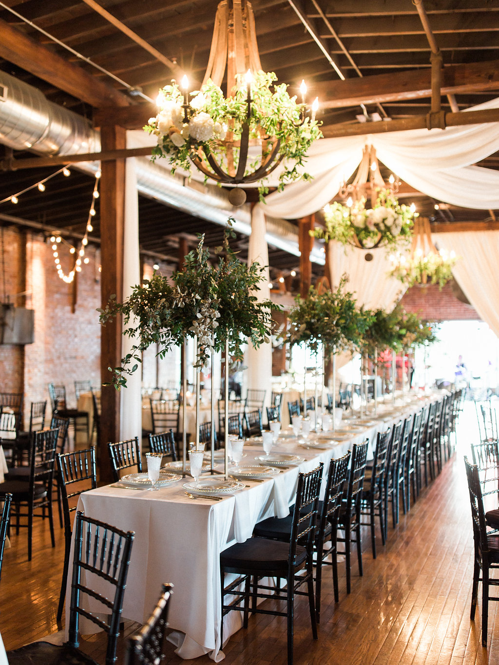 Modern gold stands with lush arrangements of all greenery for the head table // Nashville Wedding Floral Design