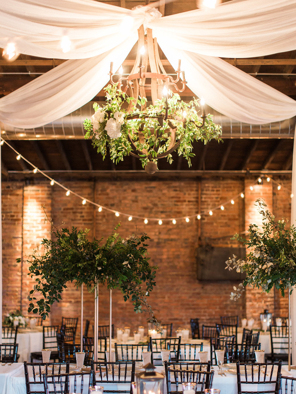 Modern gold stands with lush arrangements of all greenery for the head table // Nashville Wedding Floral Design