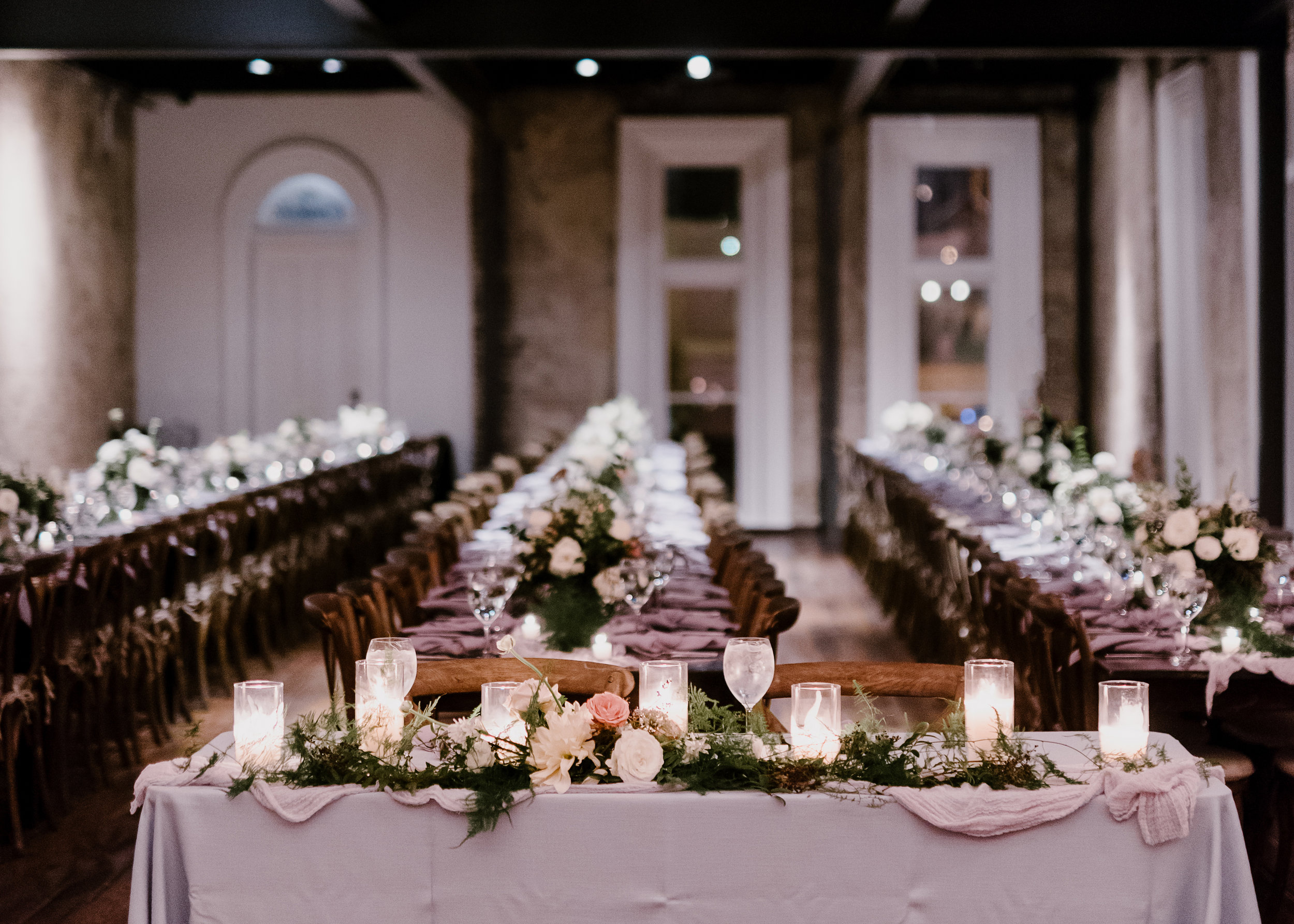 Sweetheart table with asymmetrical floral garland // Nashville Wedding Flowers