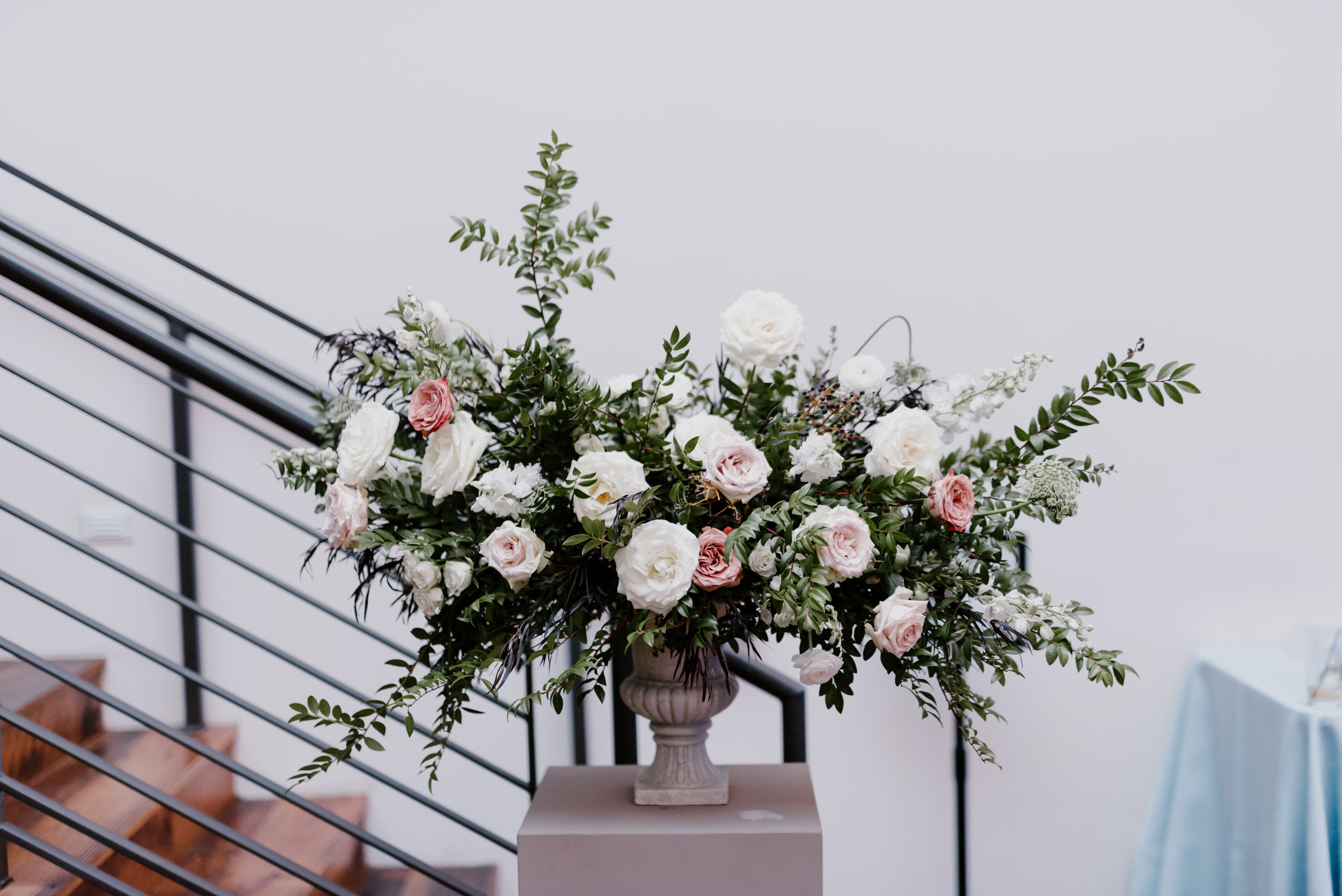 Statement floral arrangement with white flowers, hints of blush and neutrals, and organic greenery // Nashville Floral Designer