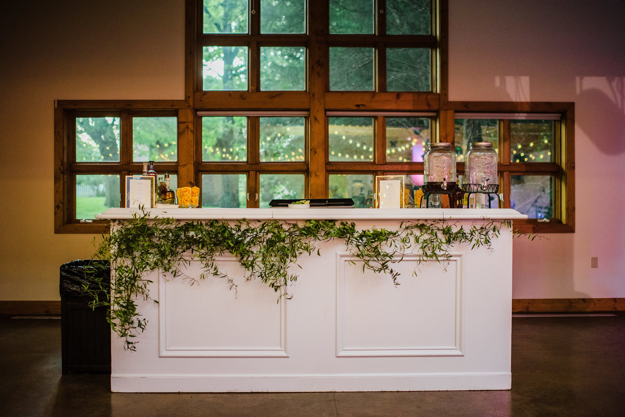 Organic greenery adorning the bar // Nashville Wedding Floral Design