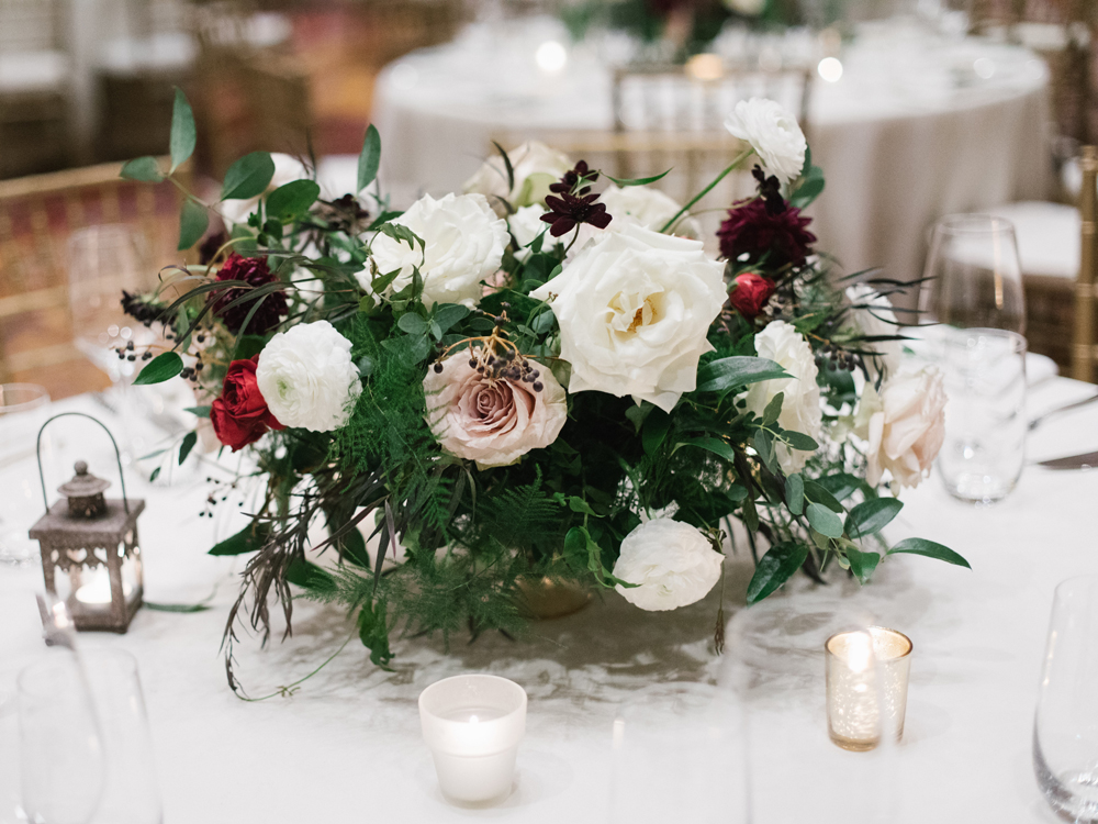Low gold vessel overflowing with lush arrangement of garden roses and dahlias // Nashville Wedding Floral Design