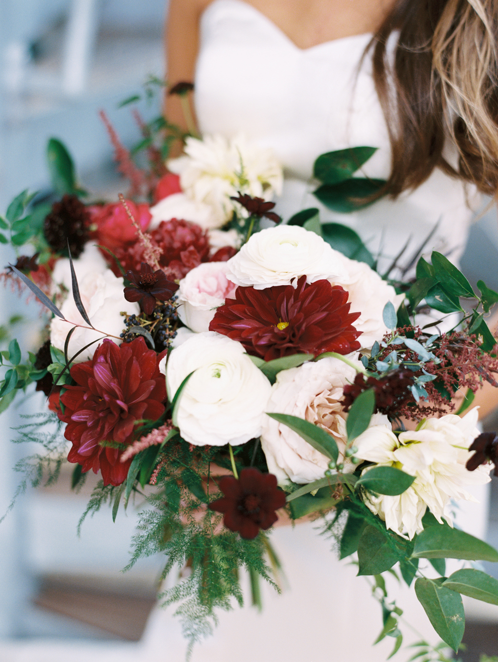 Loose, airy bridal bouquet with dahlias and garden roses in shades of burgundy and cream // Nashville Wedding Floral Design