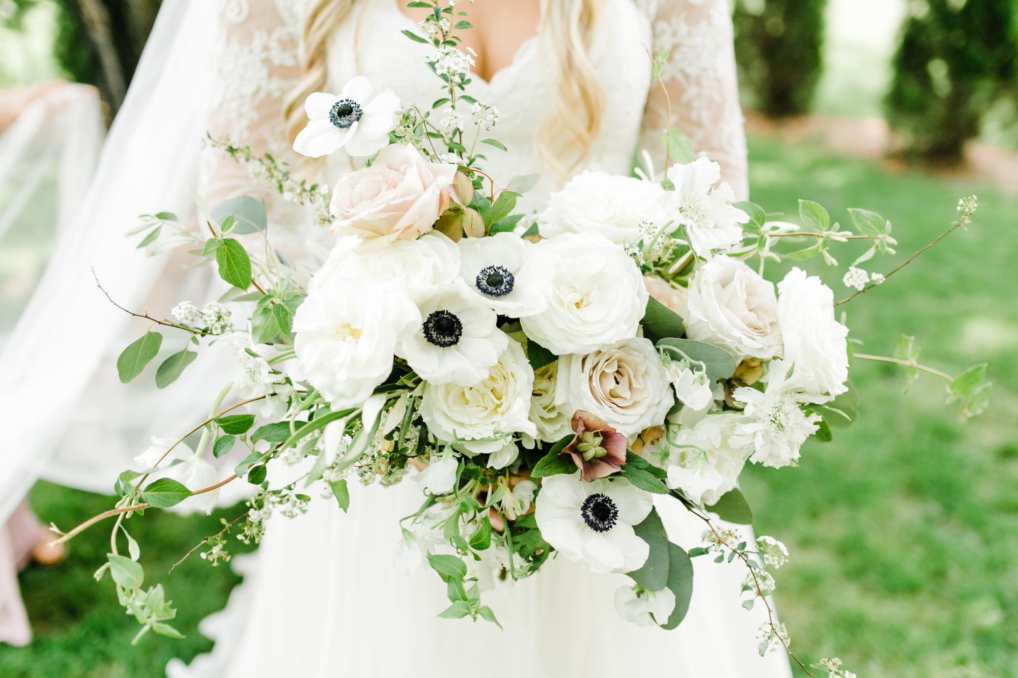 Lush, all-white bridal bouquet with anemones and garden roses // Nashville Wedding Floral Design