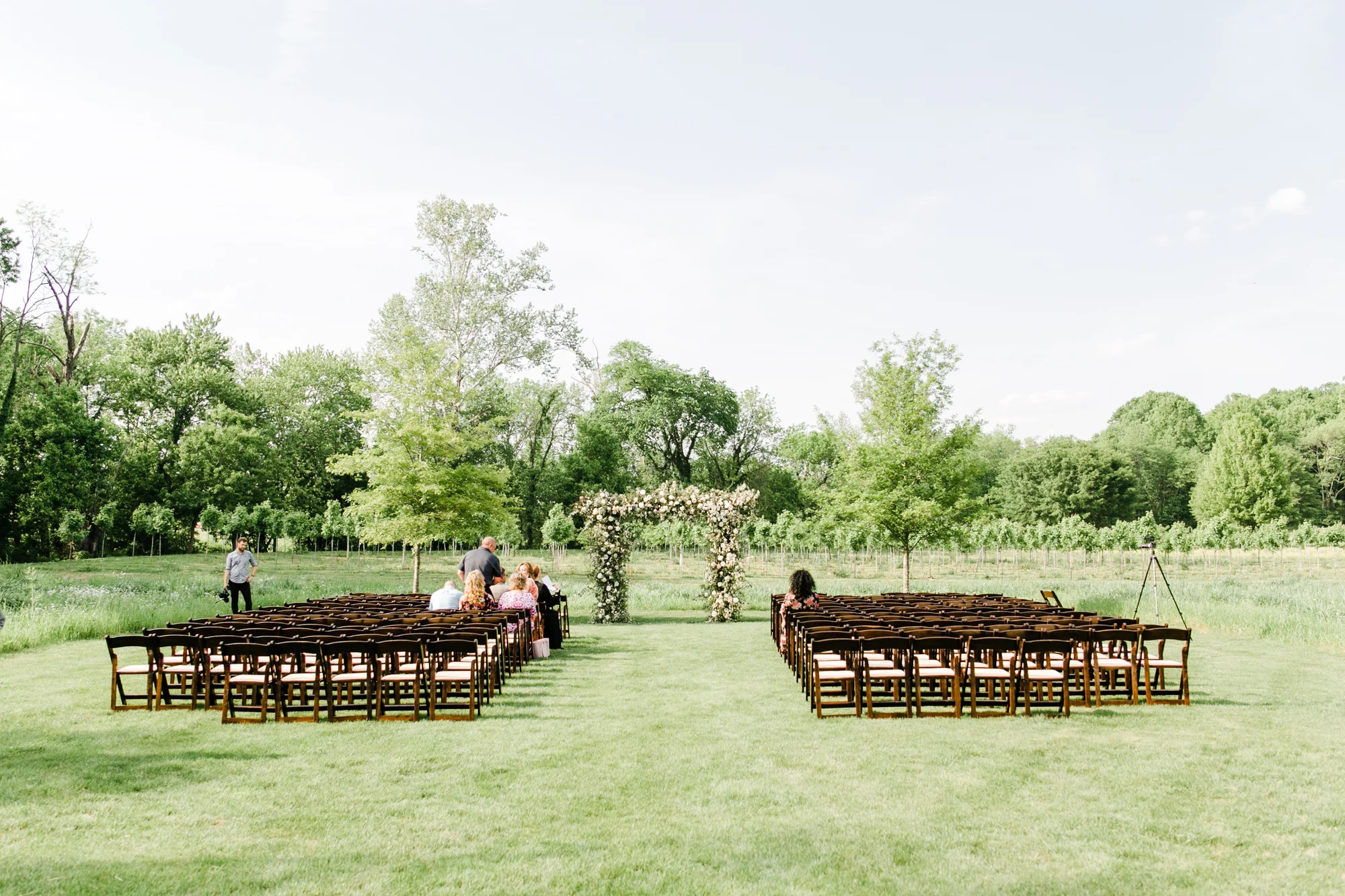 Lush garden arch in a field for the wedding ceremony // Nashville Wedding Florist