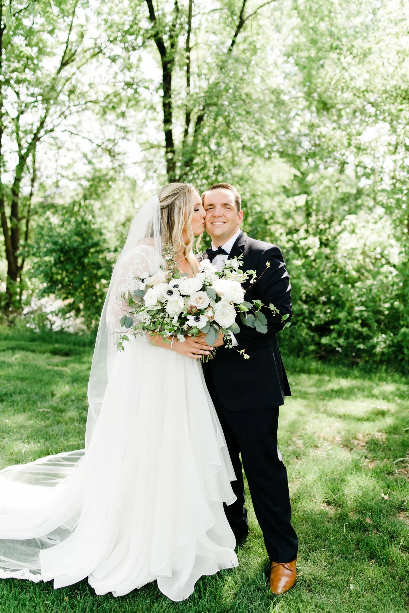 Asymmetrical, airy bridal bouquet with anemones, spirea, and garden roses // Nashville Wedding Floral Design