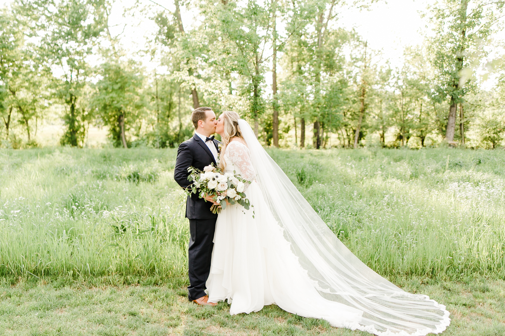 Asymmetrical, airy bridal bouquet with anemones, spirea, and garden roses // Nashville Wedding Floral Design