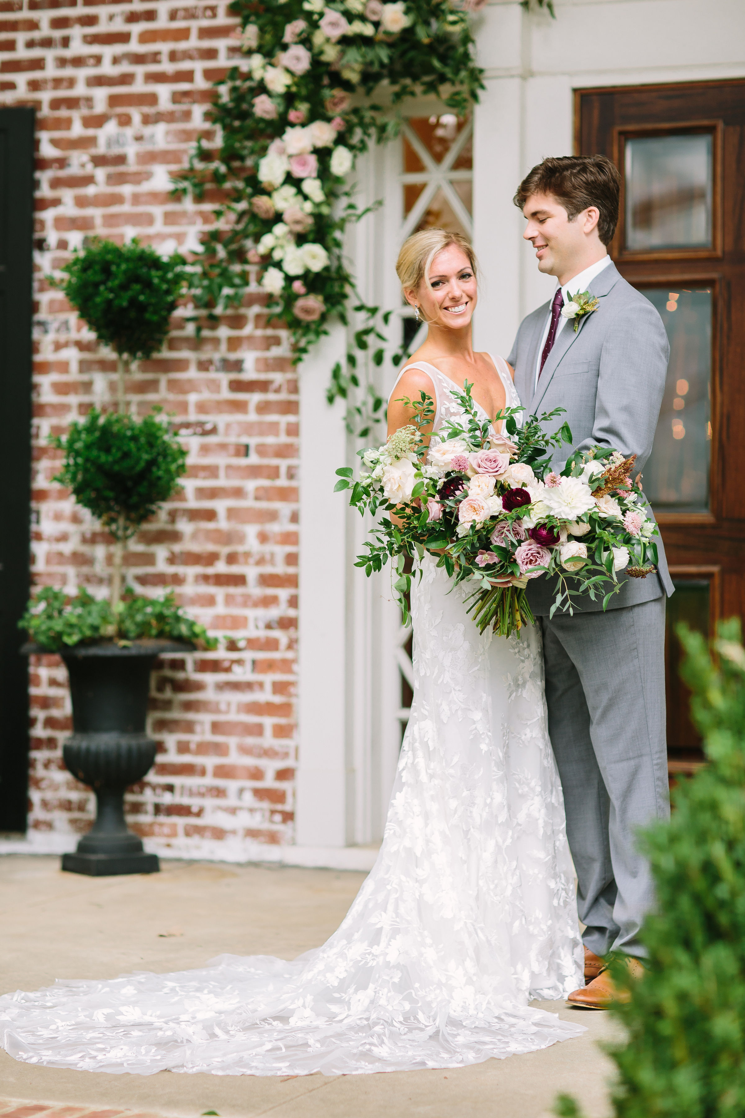 Lush, untamed bridal bouquet in shades of dusty mauve, ivory, blush, and greenery // Nashville Wedding Florist