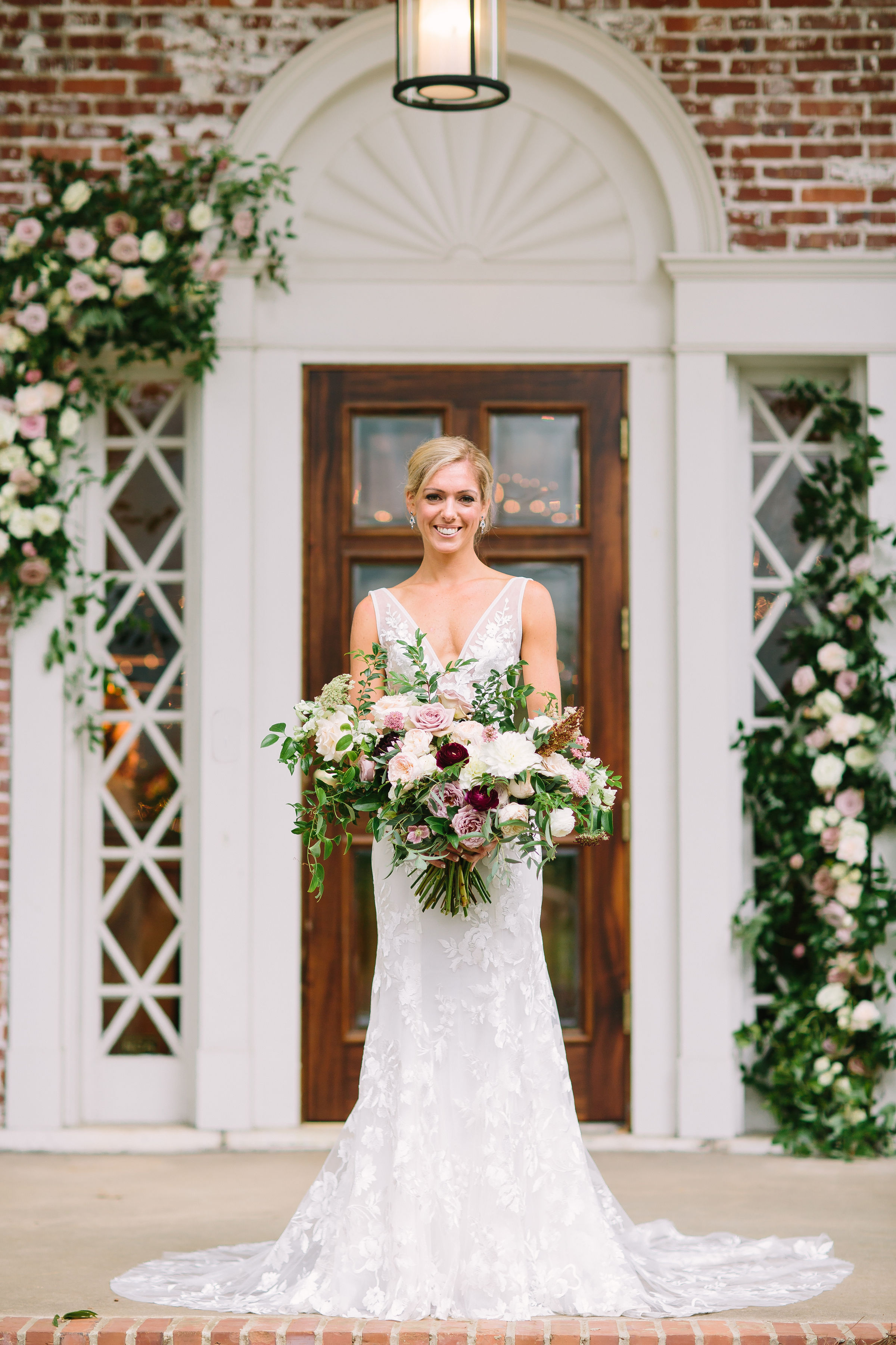 Natural, asymmetrical bridal bouquet with soft mauve garden roses, eggplant ranunculus, and trailing greenery // Nashville, TN Floral Designer