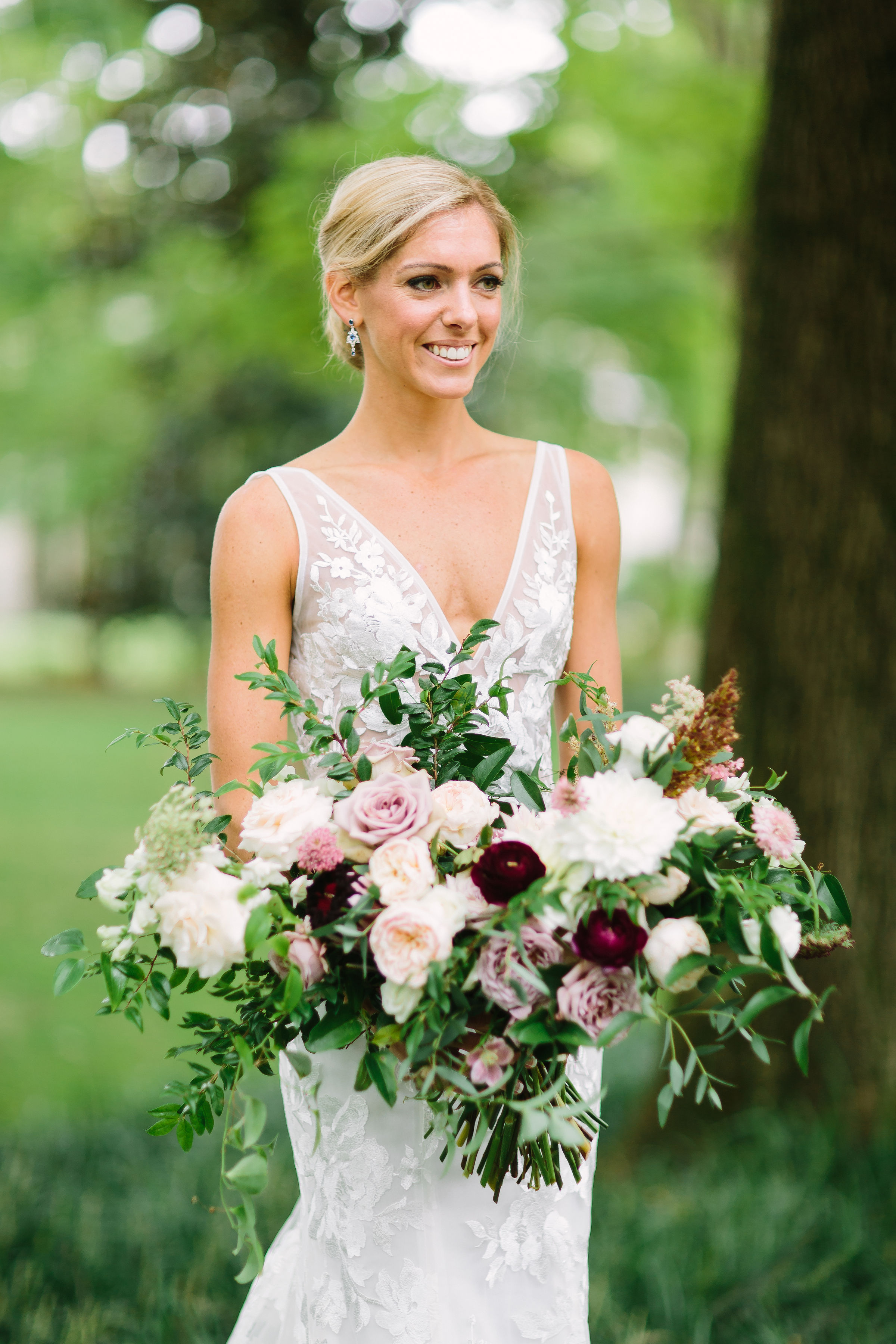 Lush, garden-inspired bridal bouquet with garden roses, ranunculus, and dahlias // Nashville Wedding Florist