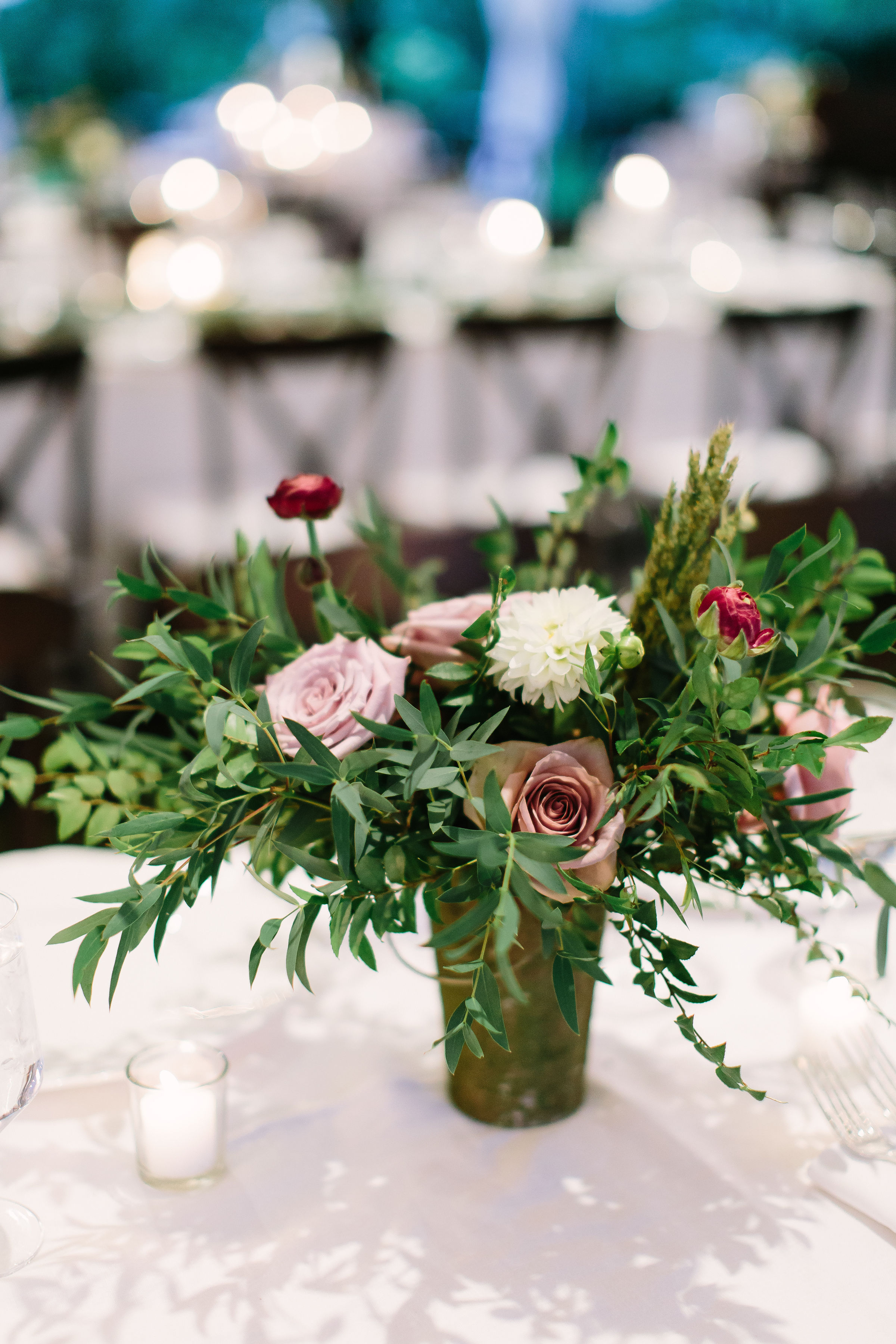 Low patina vessel filled with soft mauve and cream florals and greenery // Nashville Wedding Florist