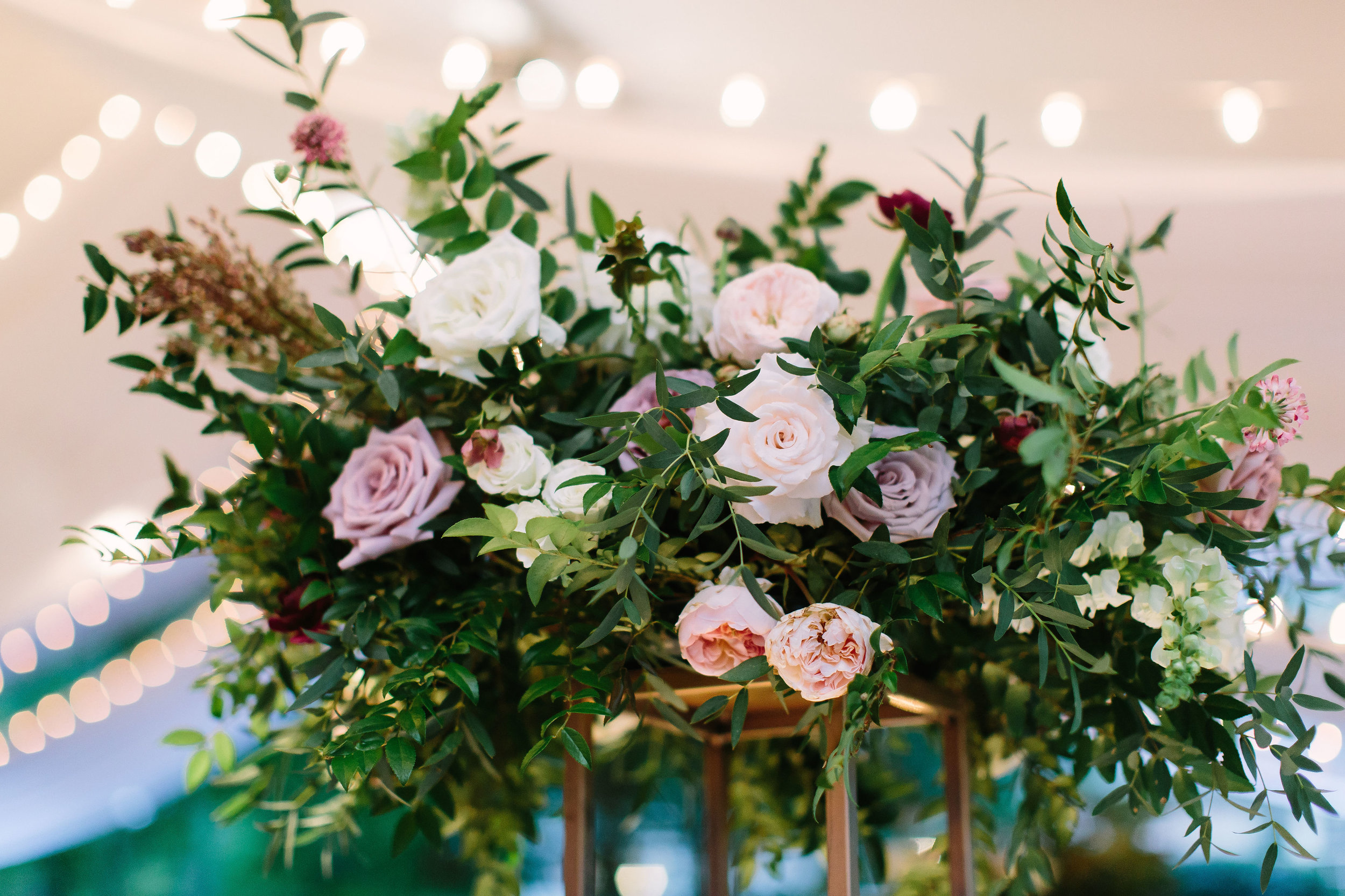 Organic, garden-inspired floral centerpiece of garden roses, ranunculus, and lush greenery // Nashville Wedding Florist