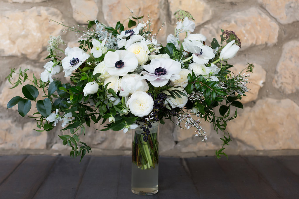 Lush all white and greenery bridal bouquet with anemones, sweet peas, garden roses, and tulips // Nashville Wedding Flowers