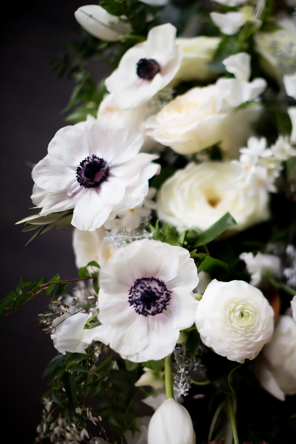 Lush all white and greenery bridal bouquet with anemones, sweet peas, garden roses, and tulips // Blackberry Farm Wedding Florist