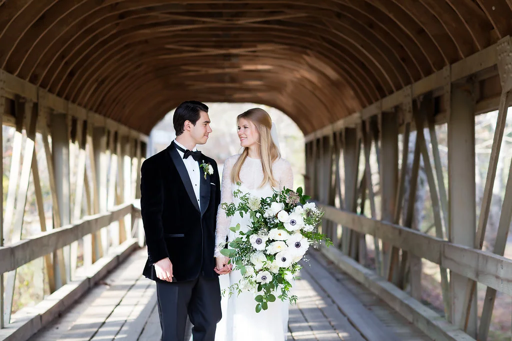 Lush all white and greenery bridal bouquet with anemones, sweet peas, garden roses, and tulips // Nashville Wedding Florist