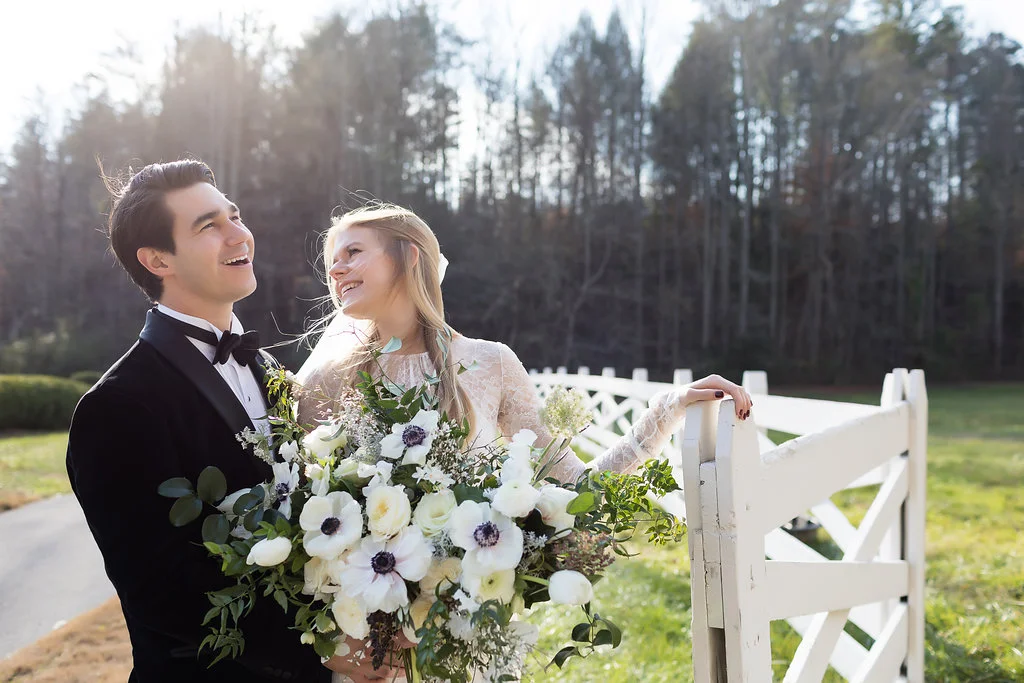 Lush all white and greenery bridal bouquet with anemones, sweet peas, garden roses, and tulips // Tennessee Wedding Florist