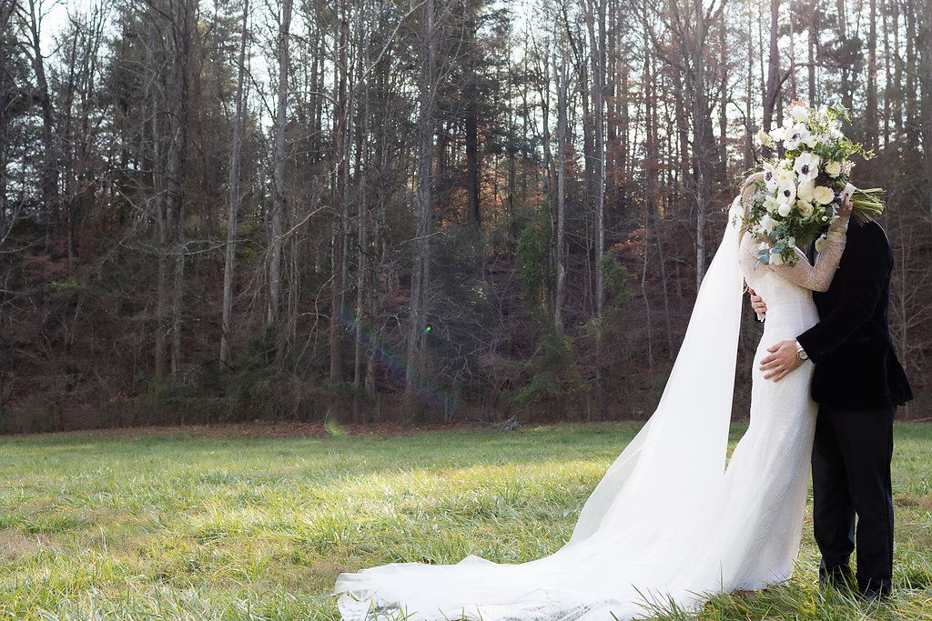 Natural, garden inspired wedding bouquets with white garden roses, anemones, tulips, ranunculus, and trailing greenery // TN Wedding Floral Design
