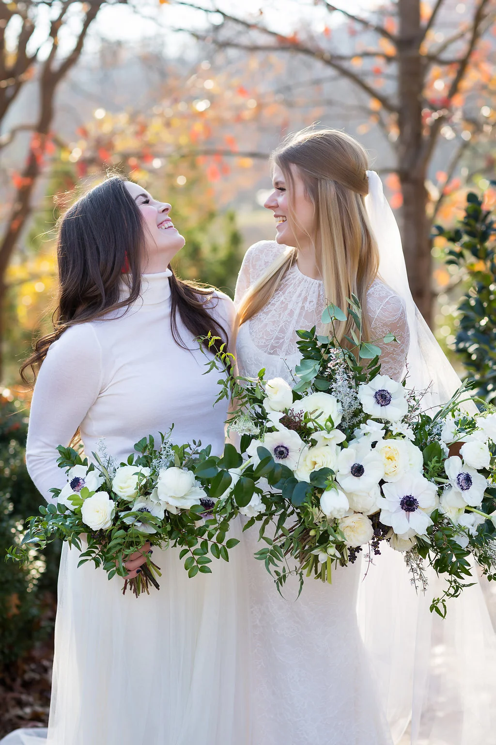 All white bridesmaid style with cashmere turtlenecks, tulle skirts, and loose bouquets of white florals and natural greenery // Nashville Wedding Flowers
