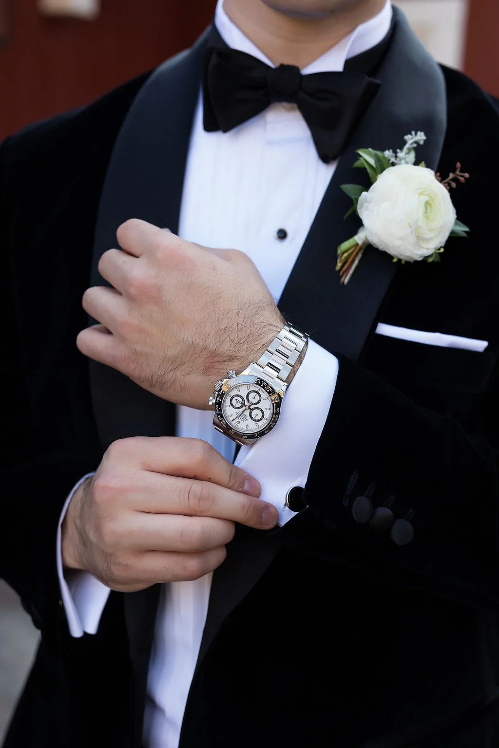 White Ranunculus groom’s boutonniere with wintry texture and natural greenery // Blackberry Farm Wedding Florist