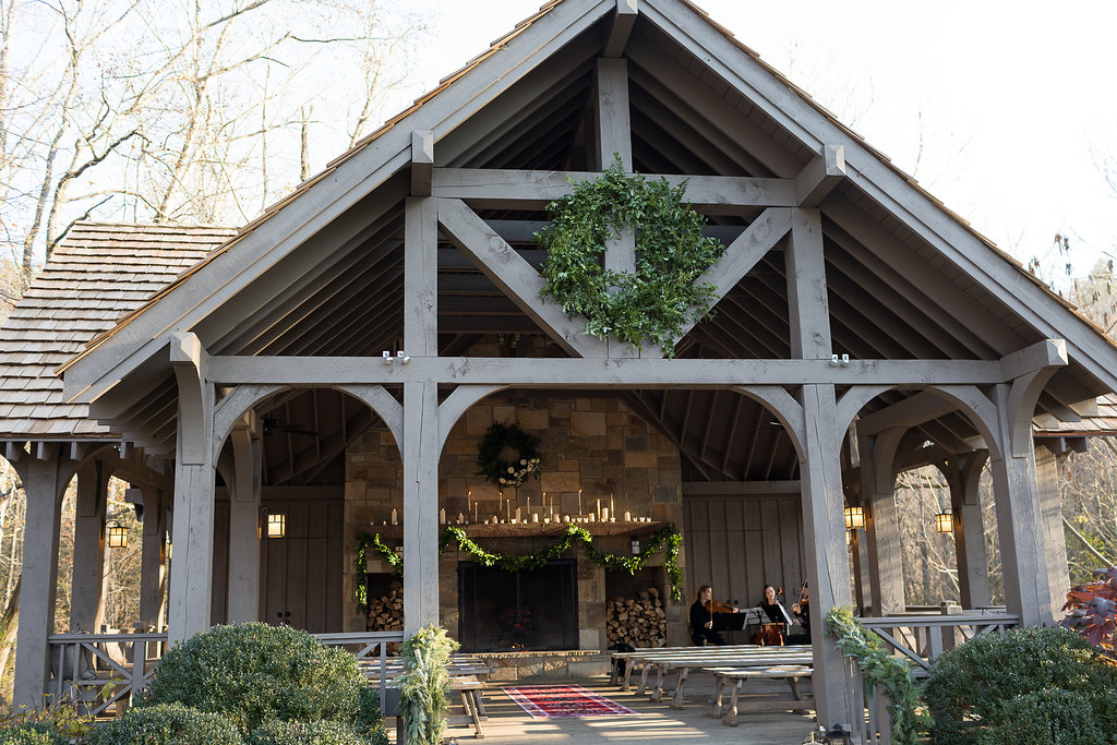 Oversized wreath and lush garlands on the pavilion for the wedding ceremony // Nashville Floral Design