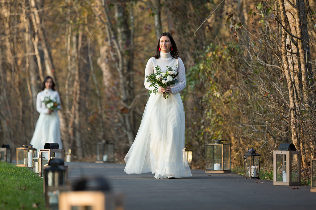 All white bridesmaid style with cashmere turtlenecks, tulle skirts, and loose bouquets of white florals and natural greenery // Nashville Wedding Flowers // Rosemary & Finch Floral Design