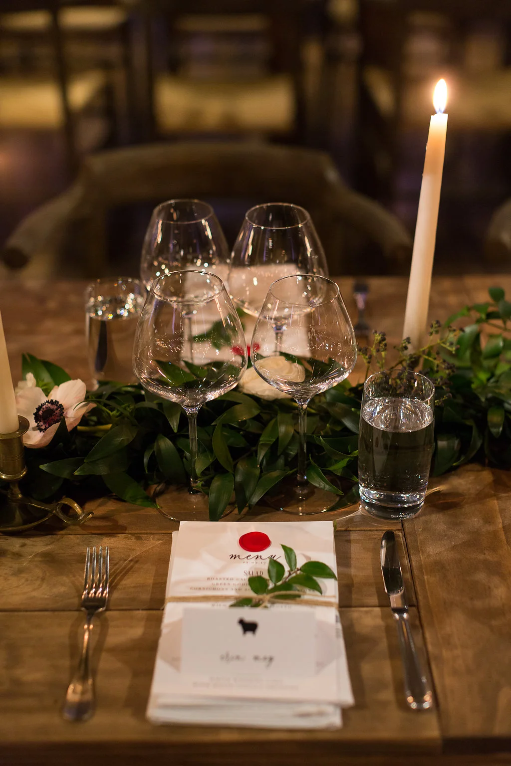 Greenery table runners with white floral accents and brass candlesticks // Southeastern Wedding Florist at Blackberry Farm // Rosemary & Finch Floral Design