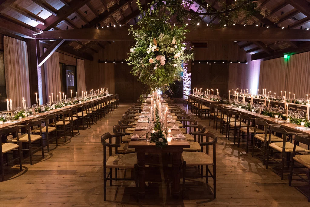 Lush greenery garland runners with floral accents of anemones and white garden roses on farm tables // Nashville Wedding Florist // Rosemary & Finch Floral Design