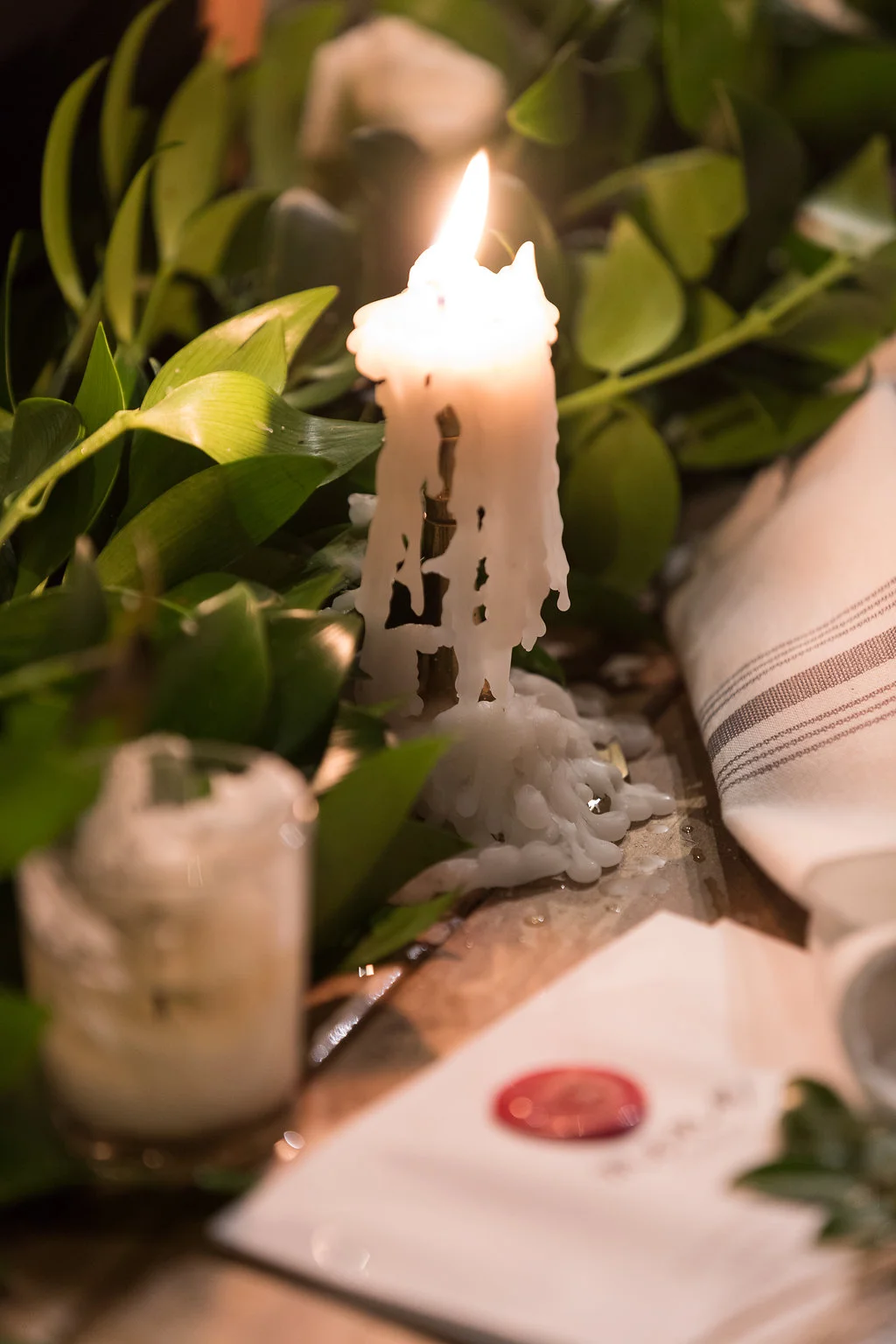 Greenery table runners with white floral accents and brass candlesticks // Southeastern Wedding Florist at Blackberry Farm // Rosemary & Finch Floral Design