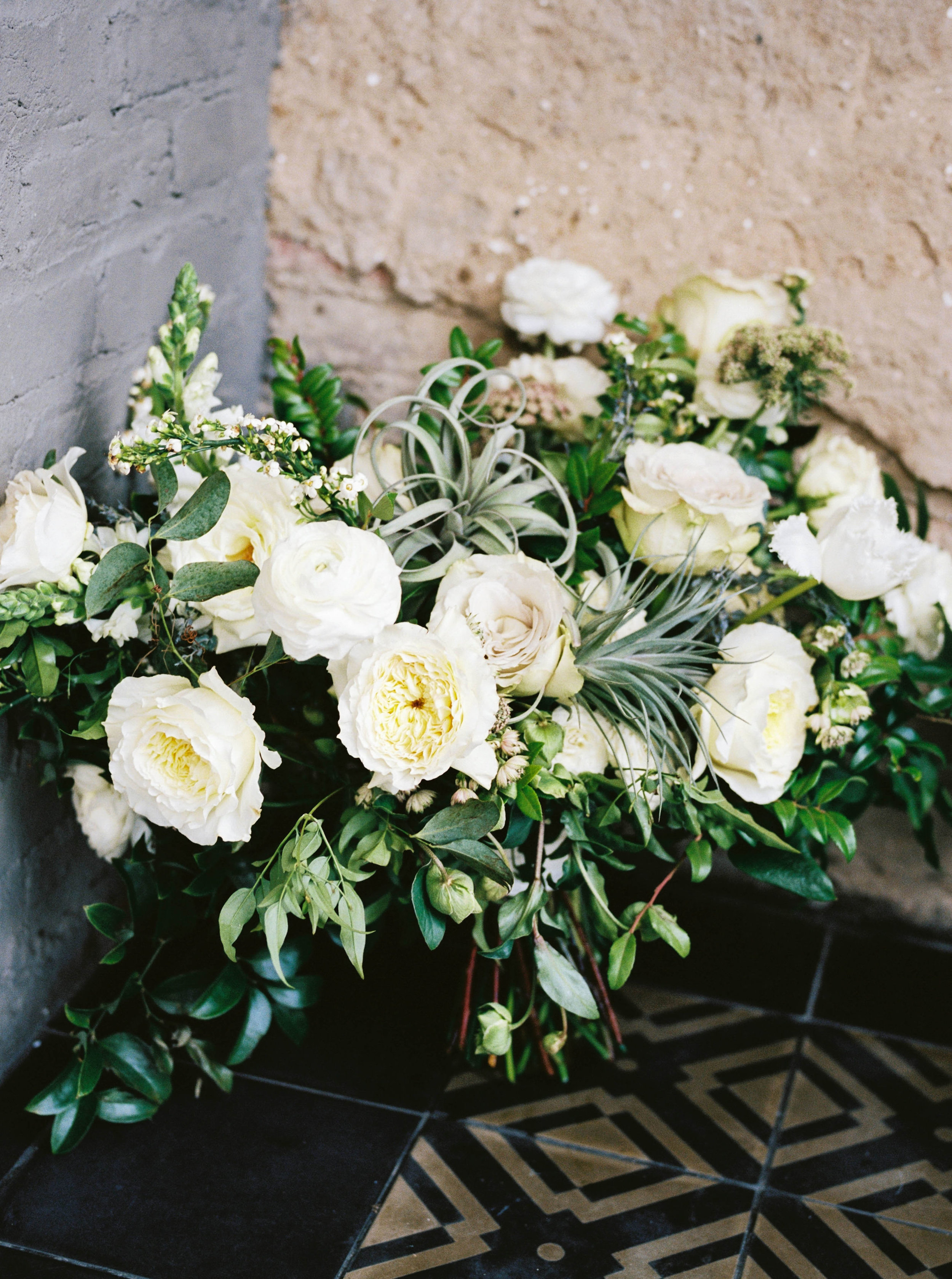 Lush white and cream bridal bouquet with air plants, greenery and texture // Southern Wedding Florist