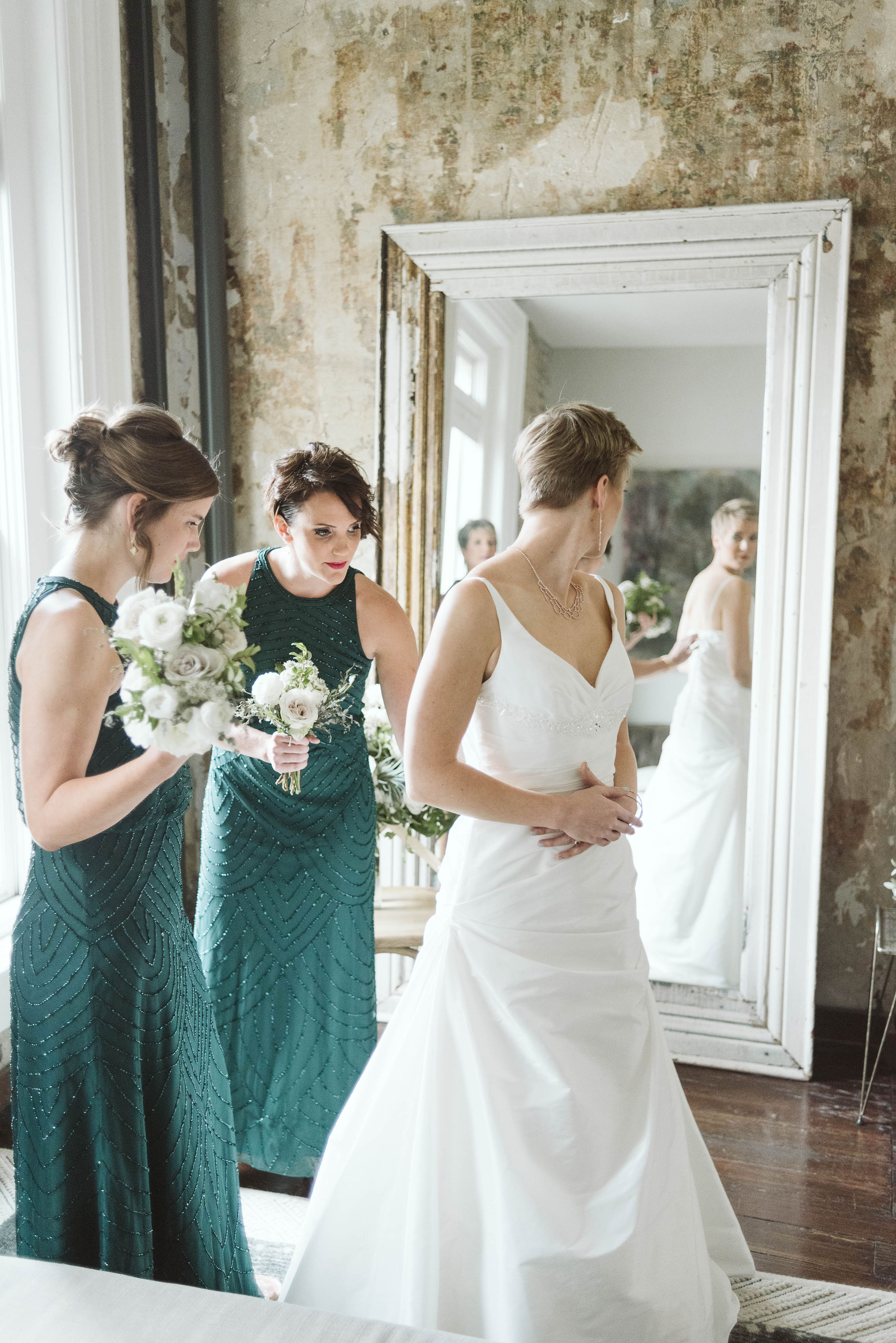 Emerald bridesmaid dresses with white and neutral bouquets // Nashville Wedding Flowers