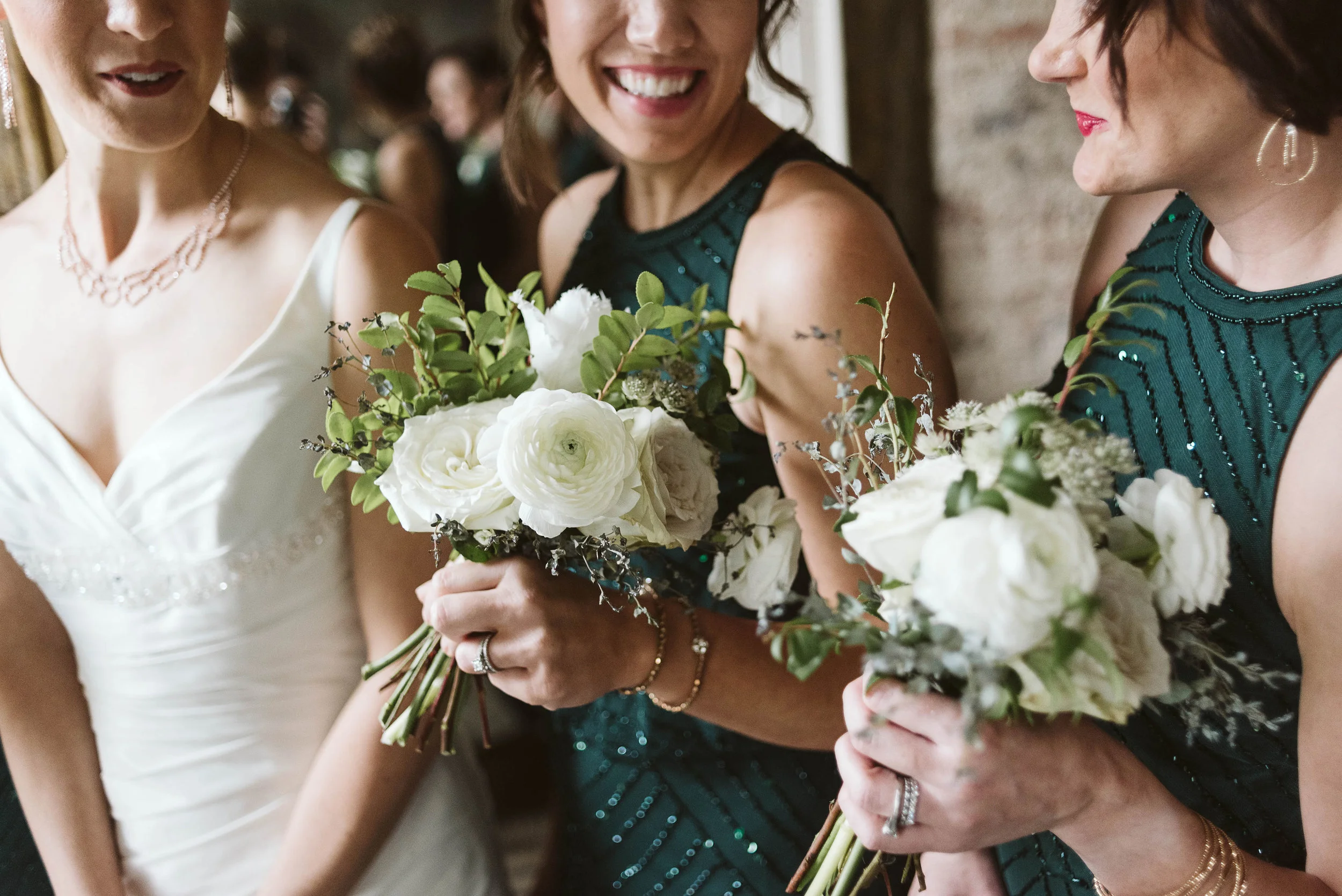 Emerald bridesmaid dresses with white and neutral bouquets // Nashville Wedding Flowers
