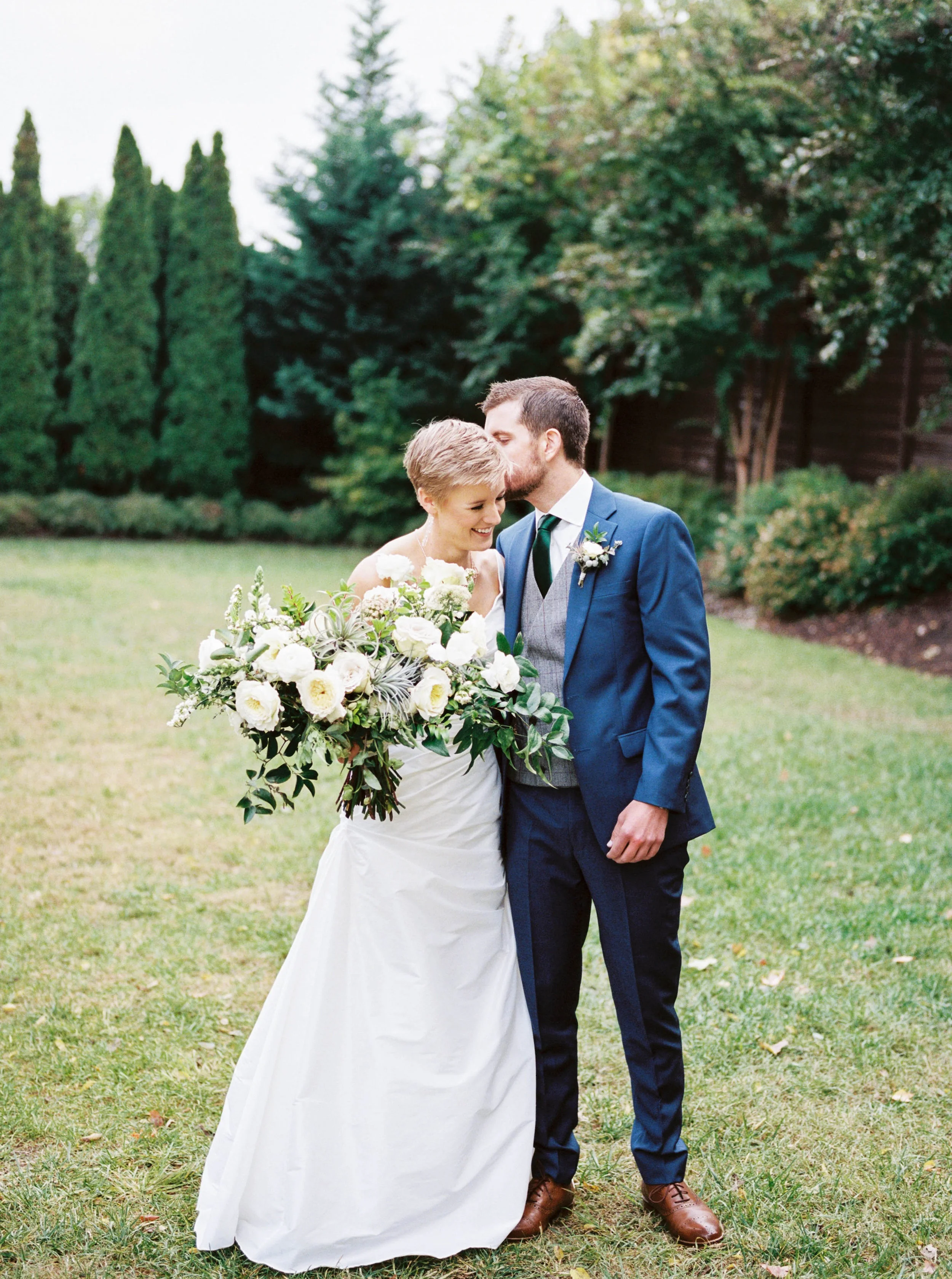 Lush white and cream bridal bouquet with air plants, greenery and texture // Southern Wedding Florist