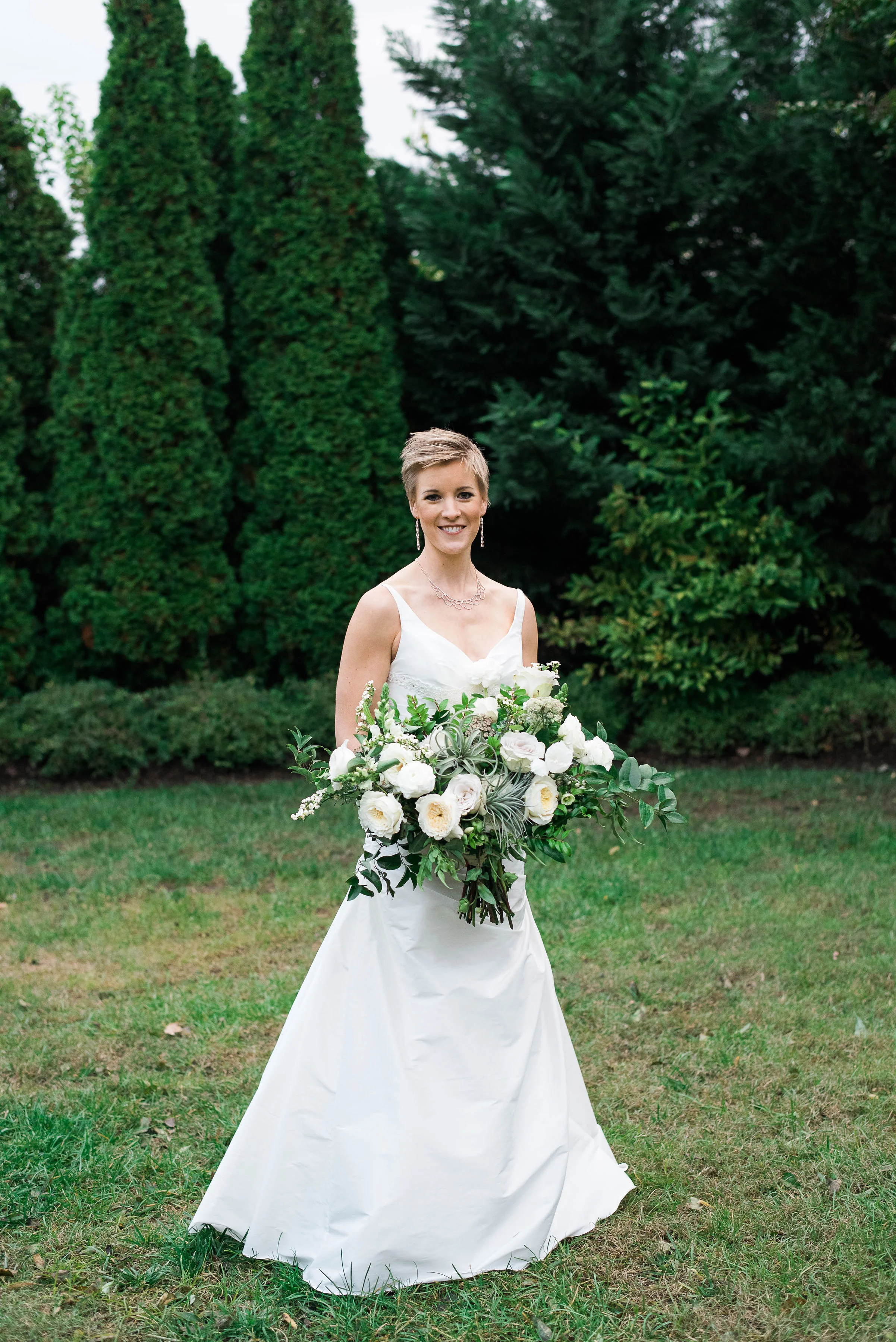 Organic bridal bouquet with garden roses, ranunculus, air plants, and greenery // Nashville, TN Wedding Florist