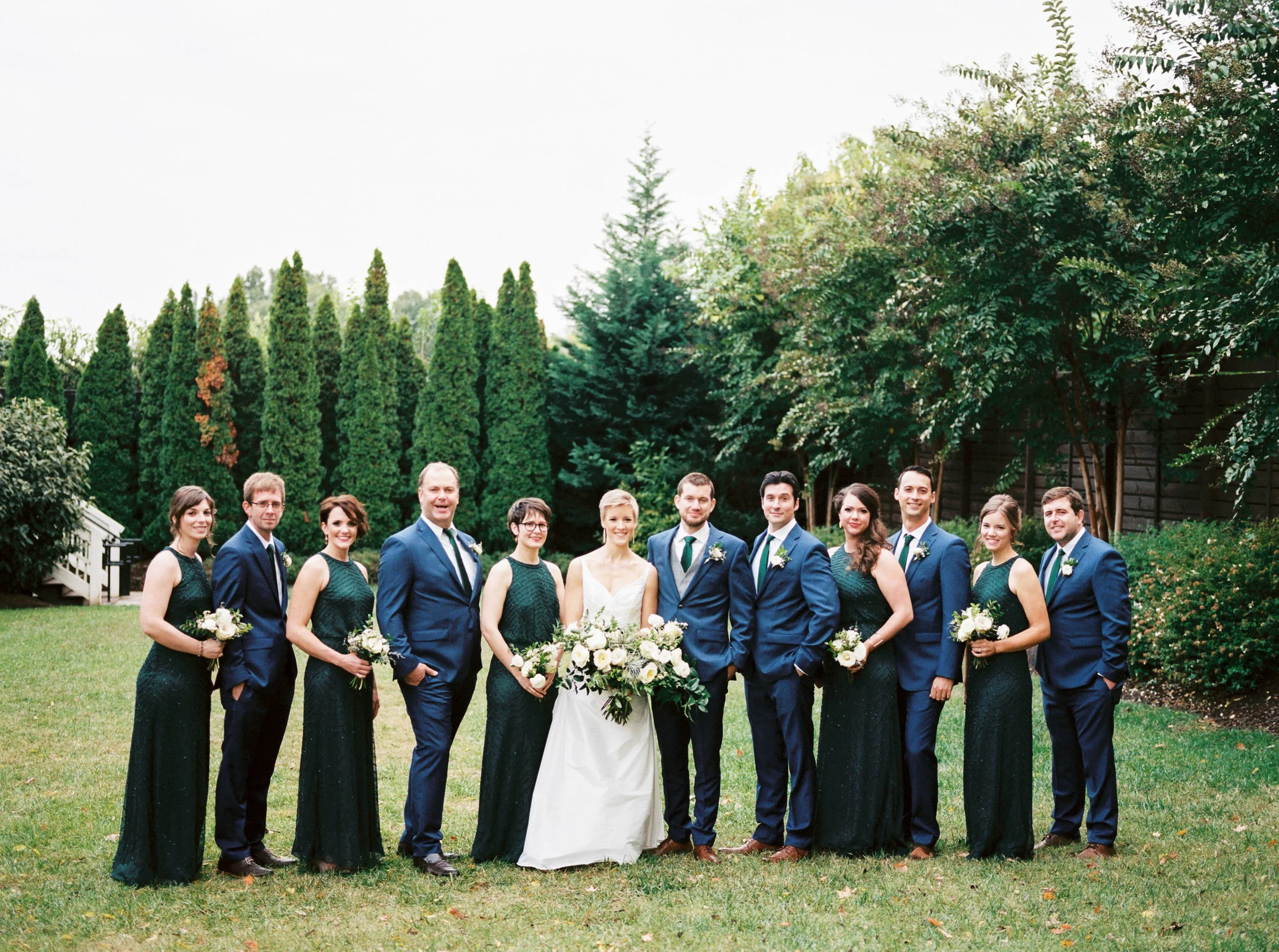 Emerald bridesmaid dresses with white and neutral bouquets // Nashville Wedding Flowers