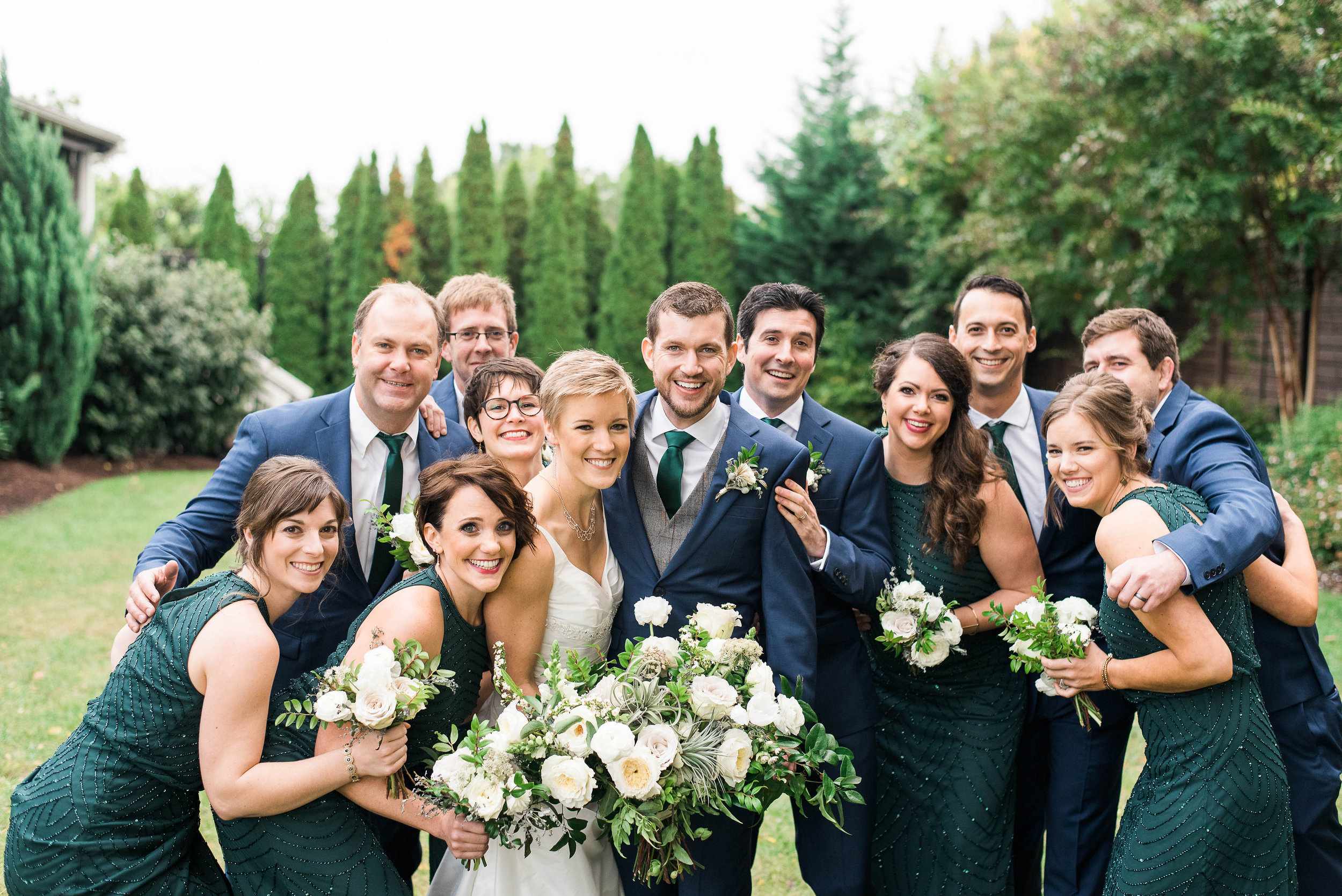 Emerald bridesmaid dresses with white and neutral bouquets // Nashville Wedding Flowers