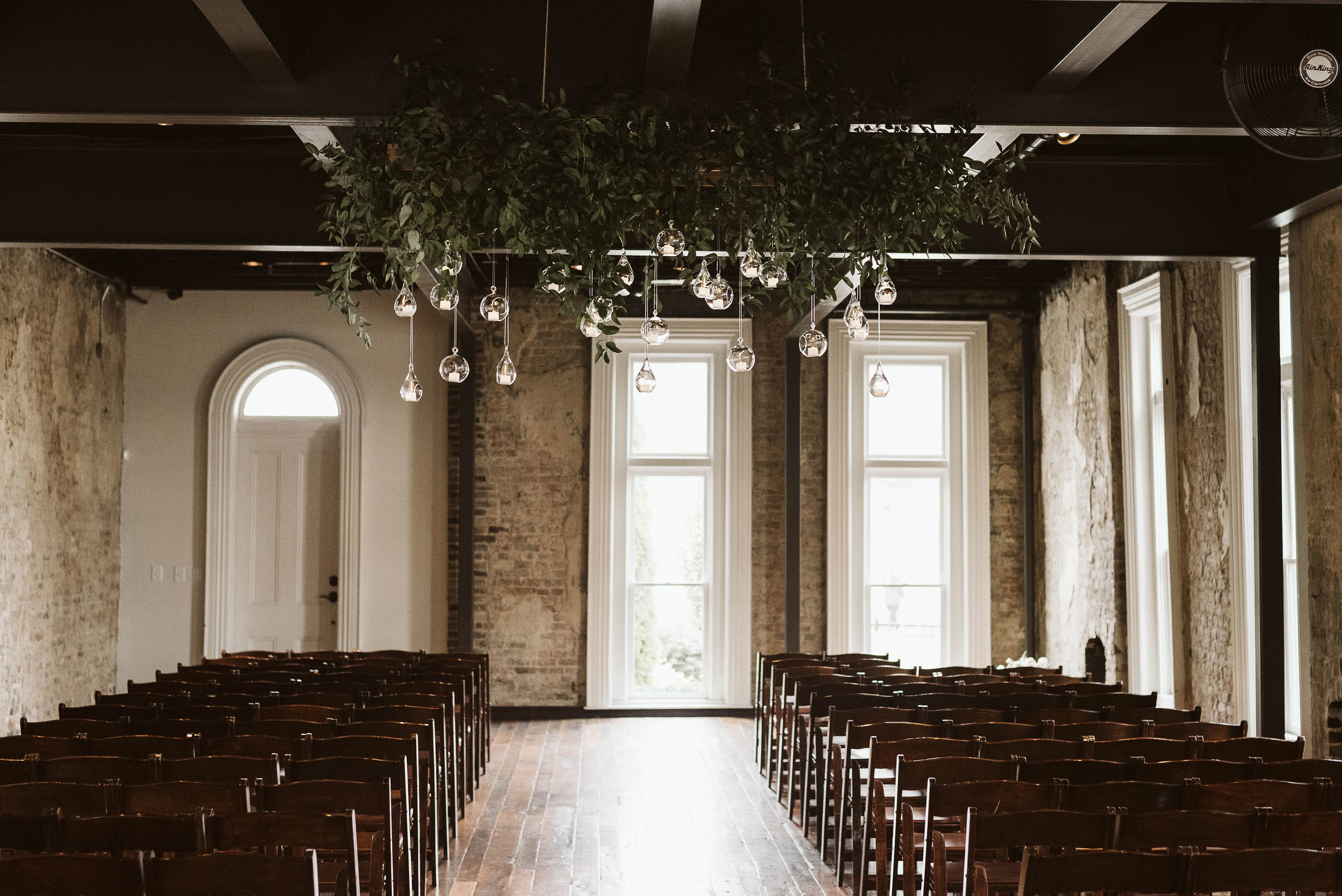 Hanging candle installation with untamed greenery // Tennessee Wedding Floral Design